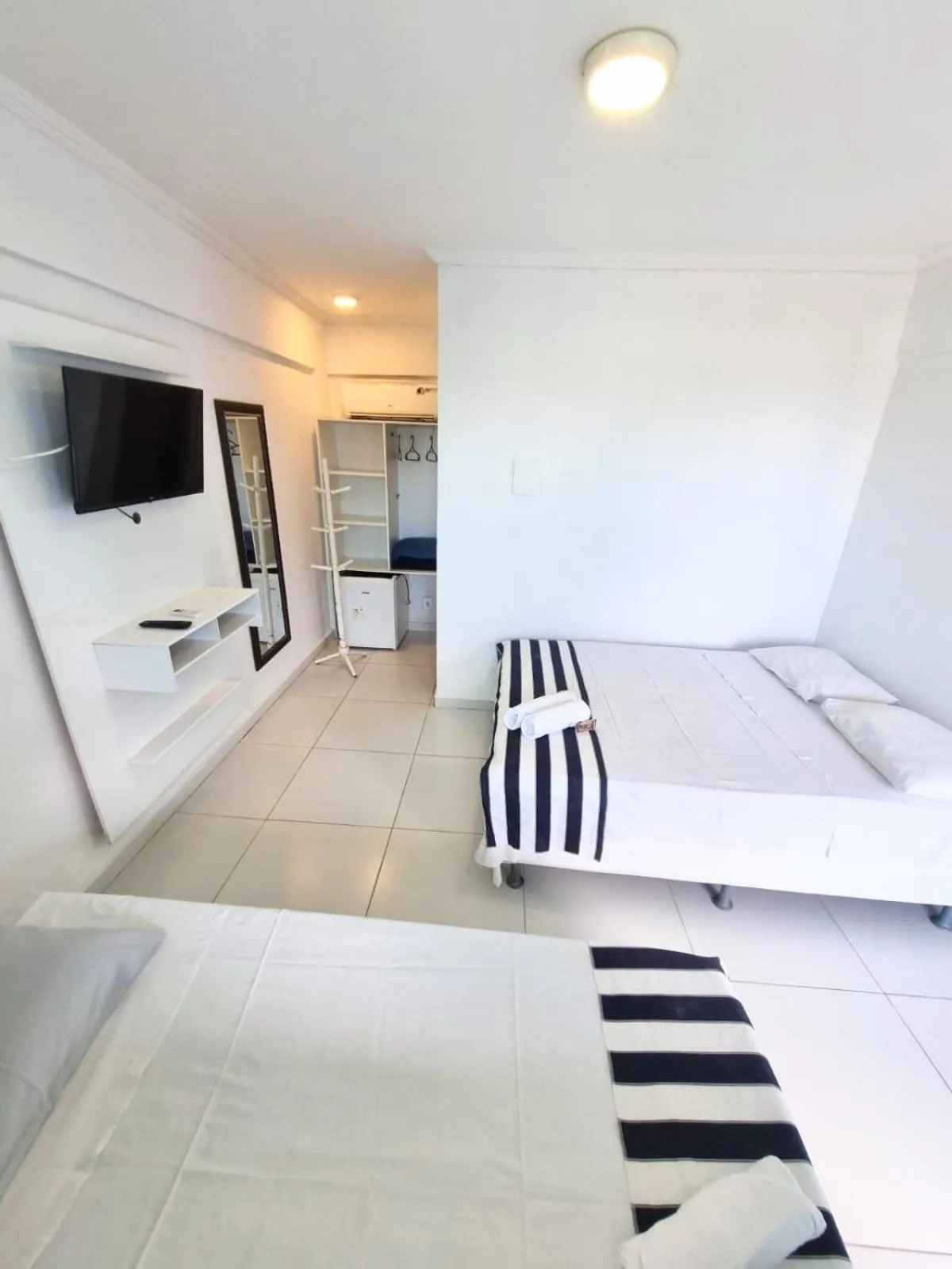 Photo of the whole room, Bed in Terra Nova Cabo Frio Front Beach