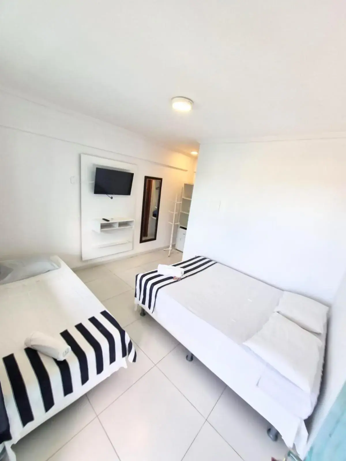 Photo of the whole room, Bed in Terra Nova Cabo Frio Front Beach Photo of the whole room, Bed in Terra Nova Cabo Frio Front Beach