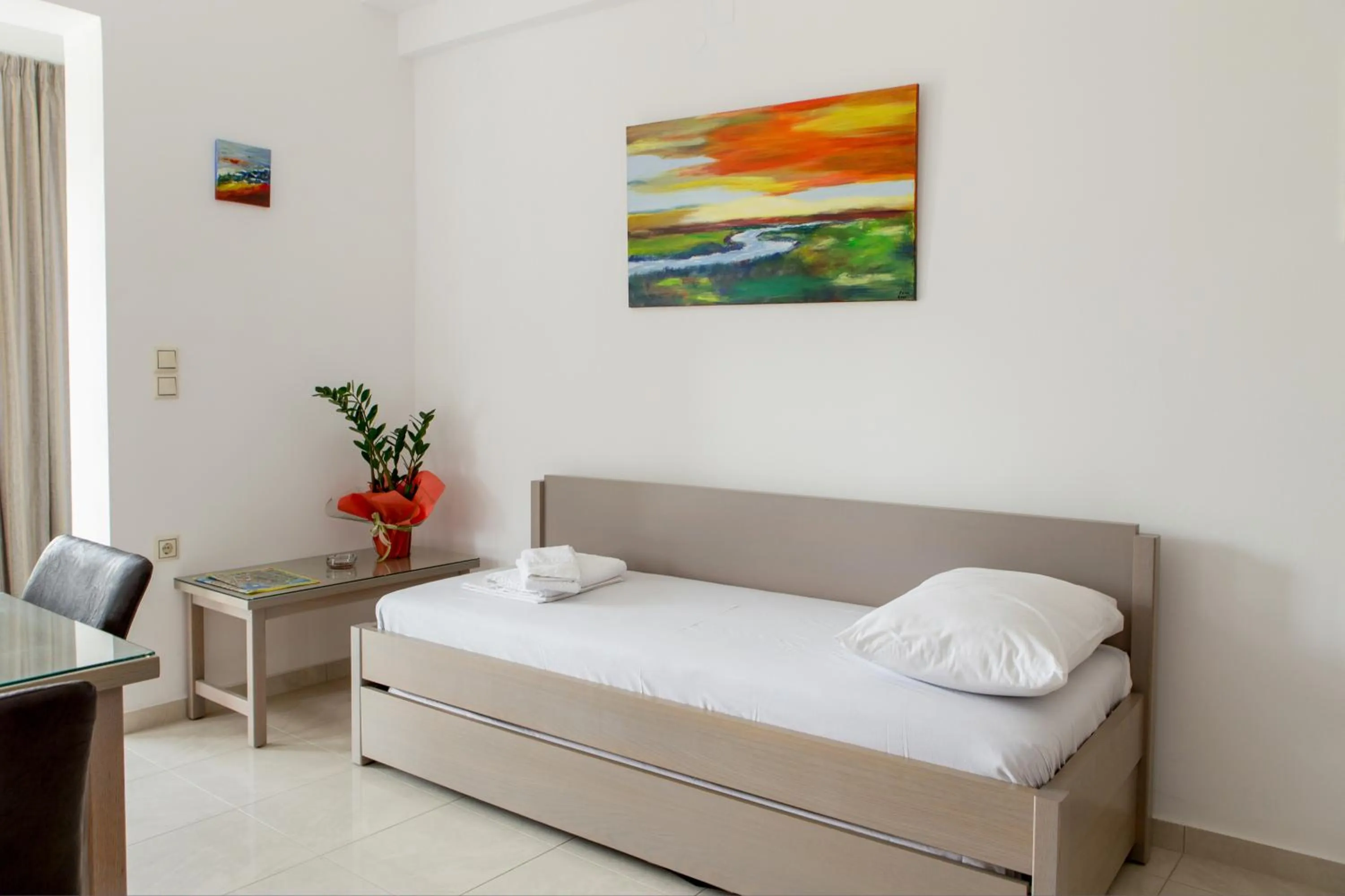 Seating area, Bed in Angela Apartments