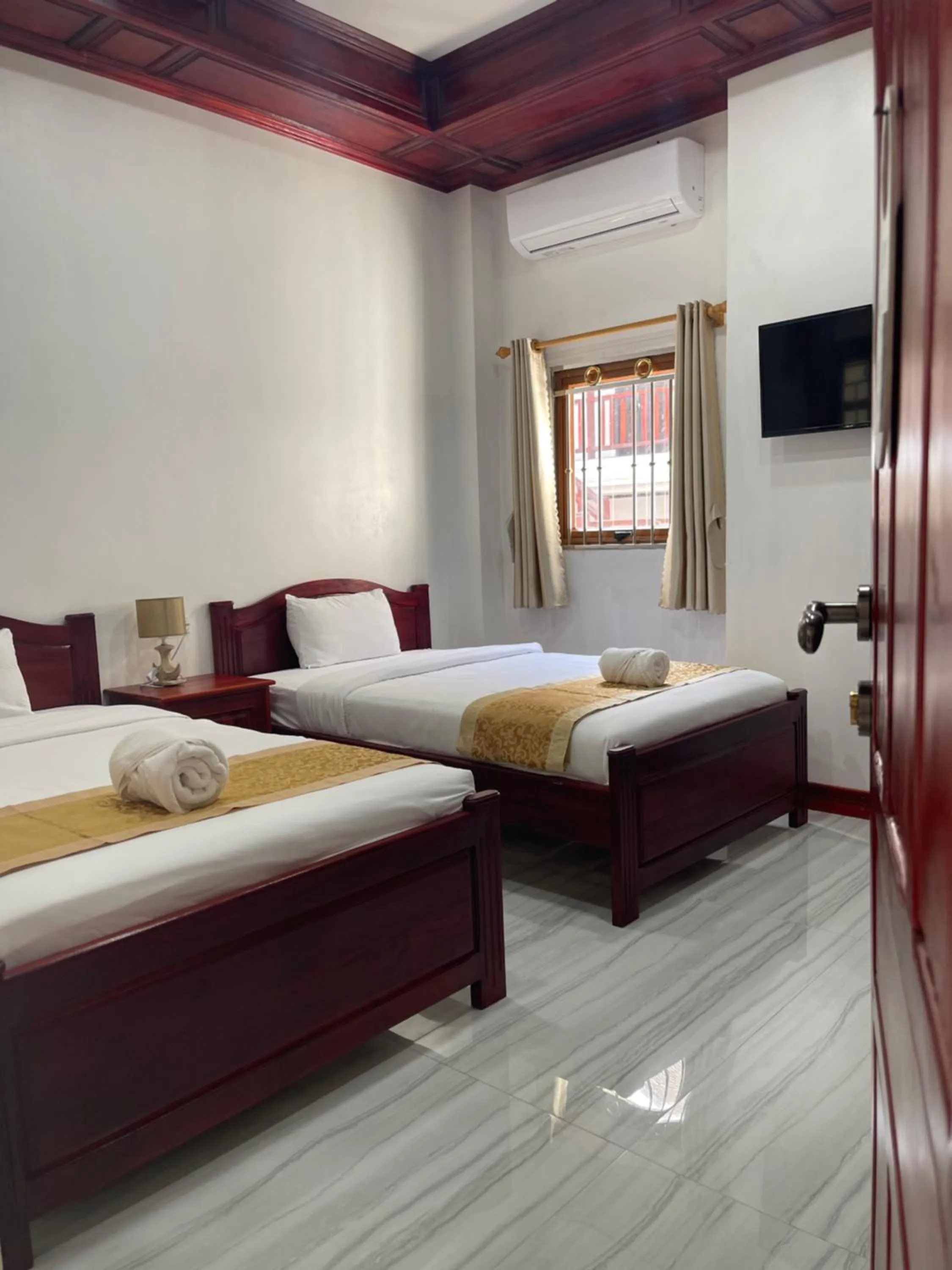 Bed in PhaiLin Hotel