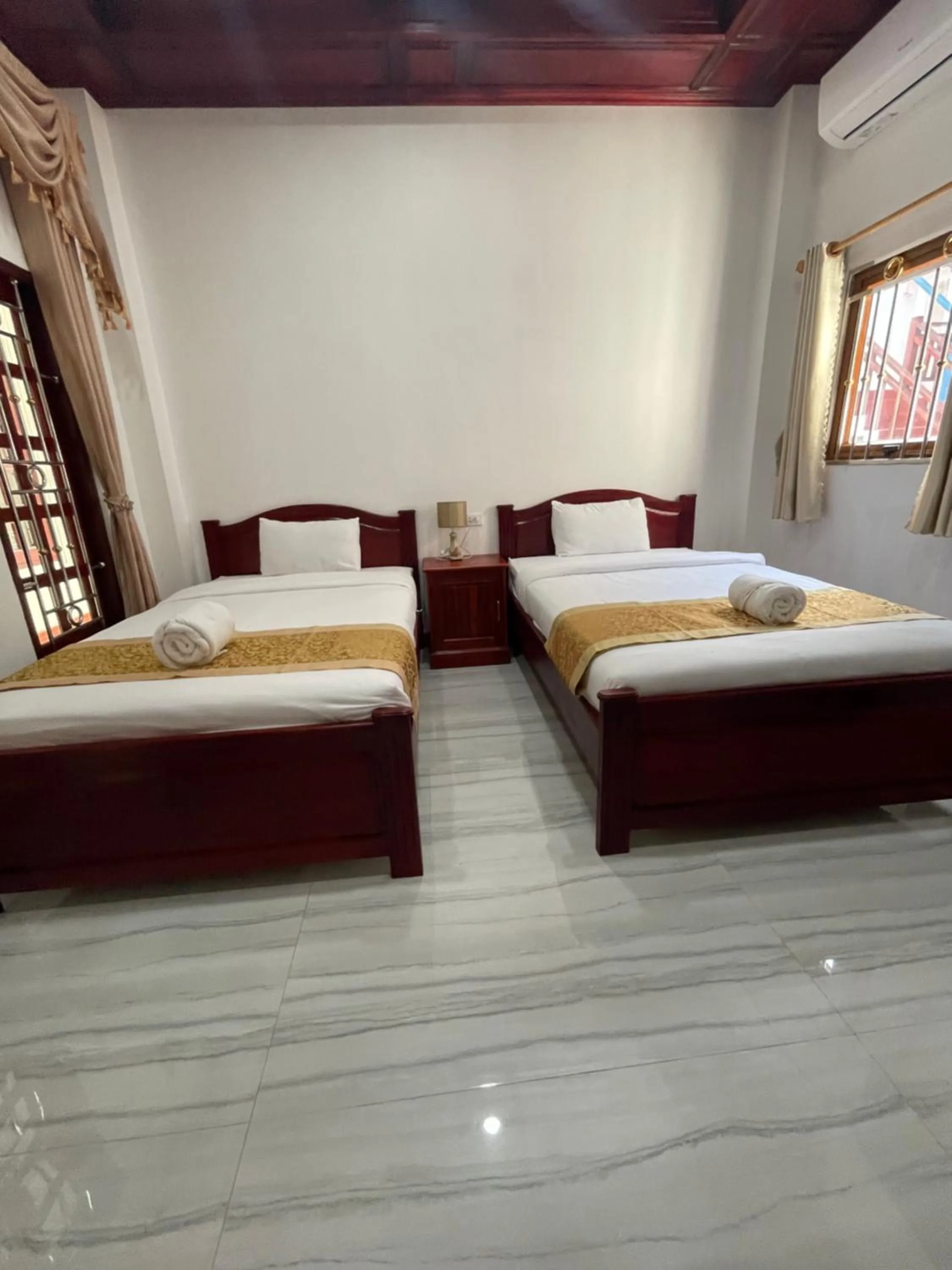 Bed in PhaiLin Hotel