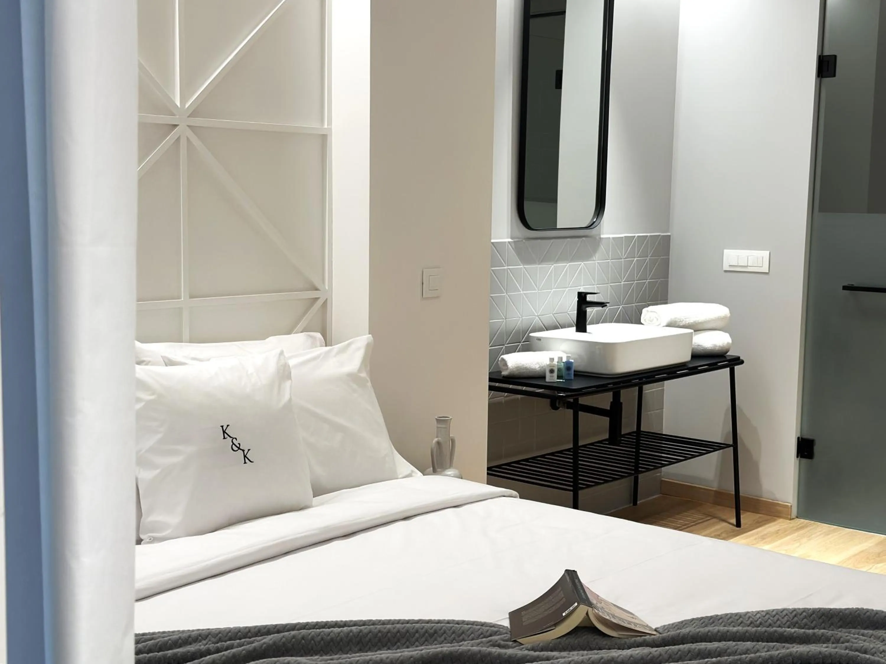 Bed in AIONION RESIDENCES by K&K