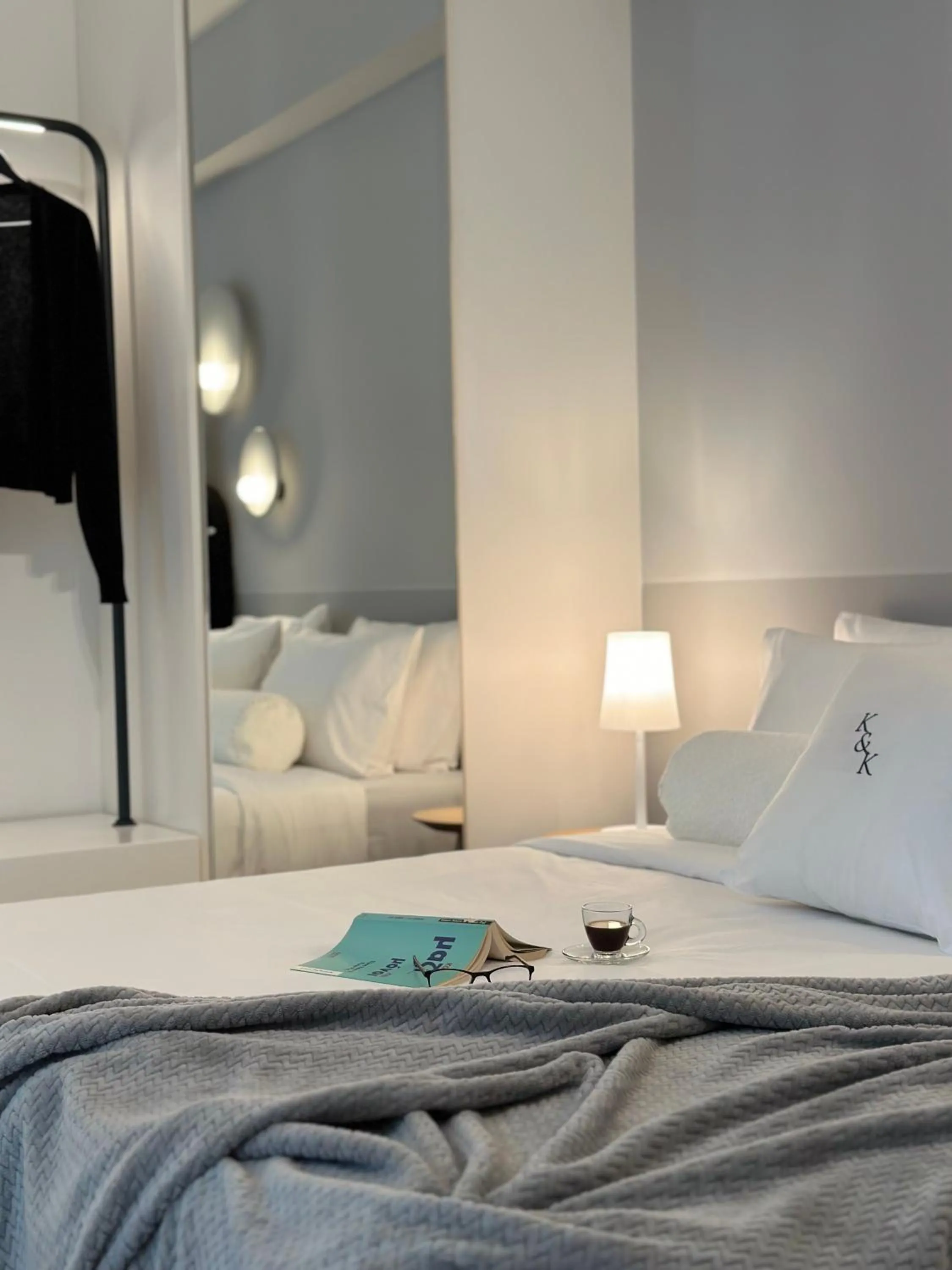 Bed in AIONION RESIDENCES by K&K