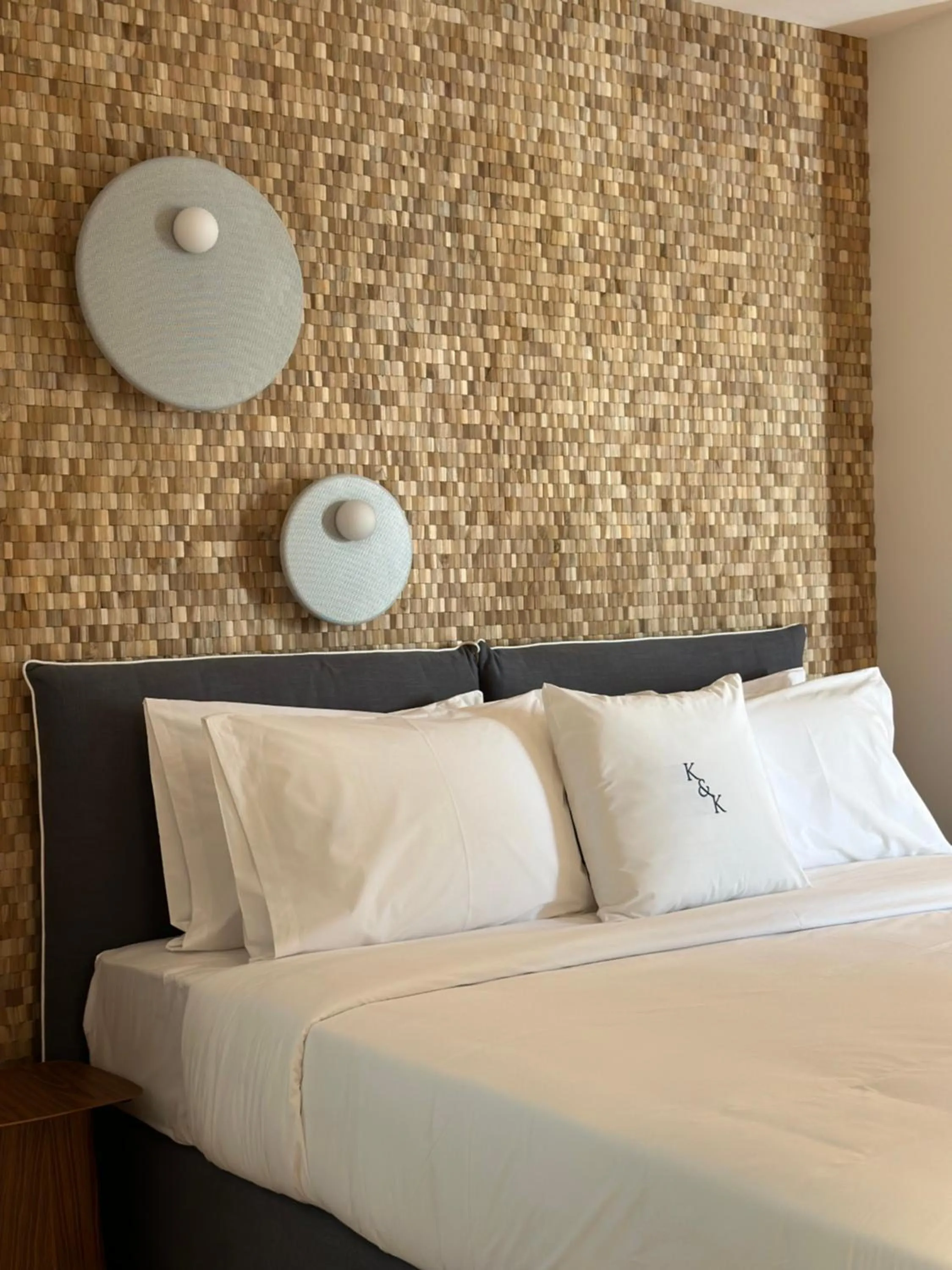 Bed in AIONION RESIDENCES by K&K