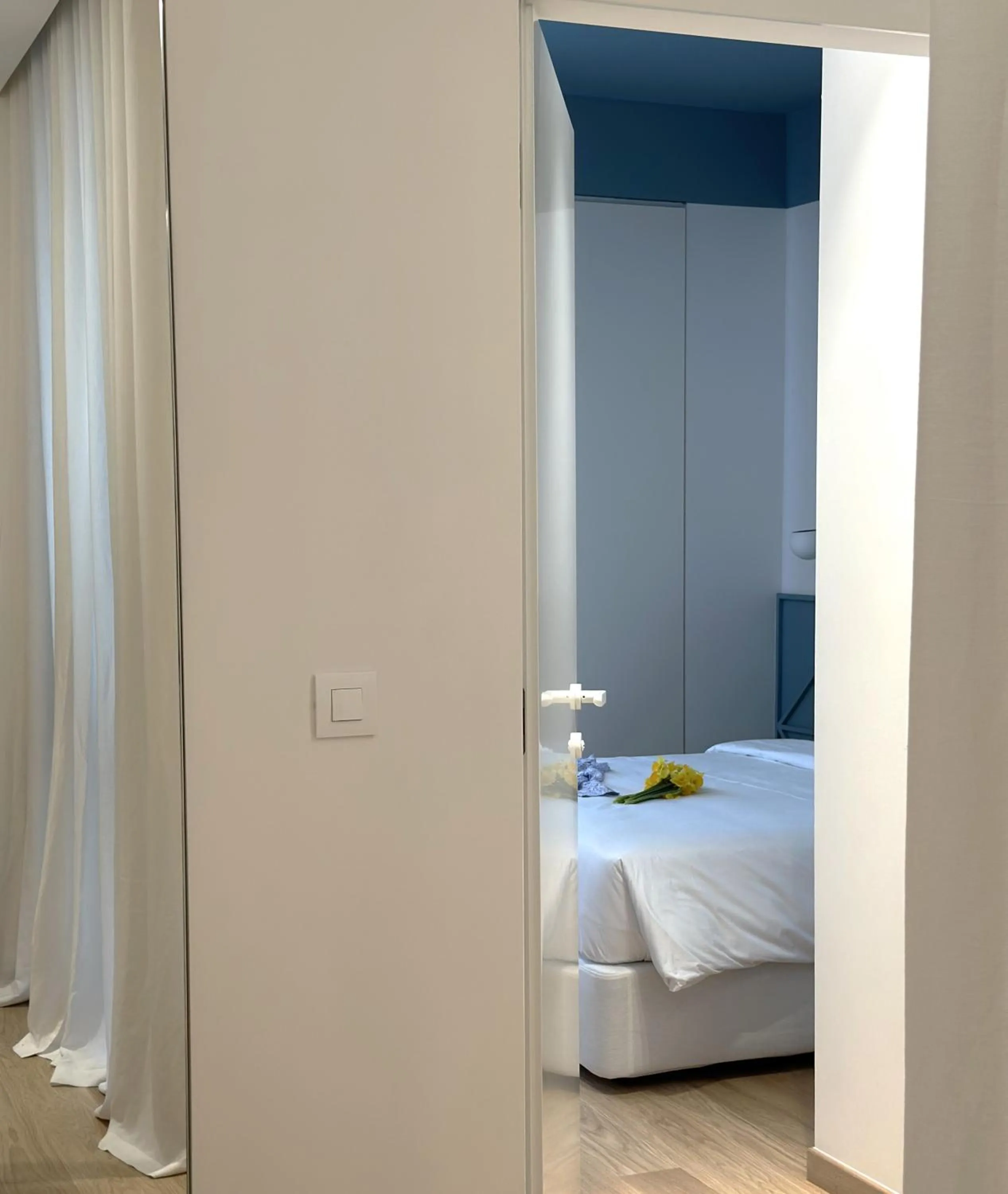 Bed in AIONION RESIDENCES by K&K