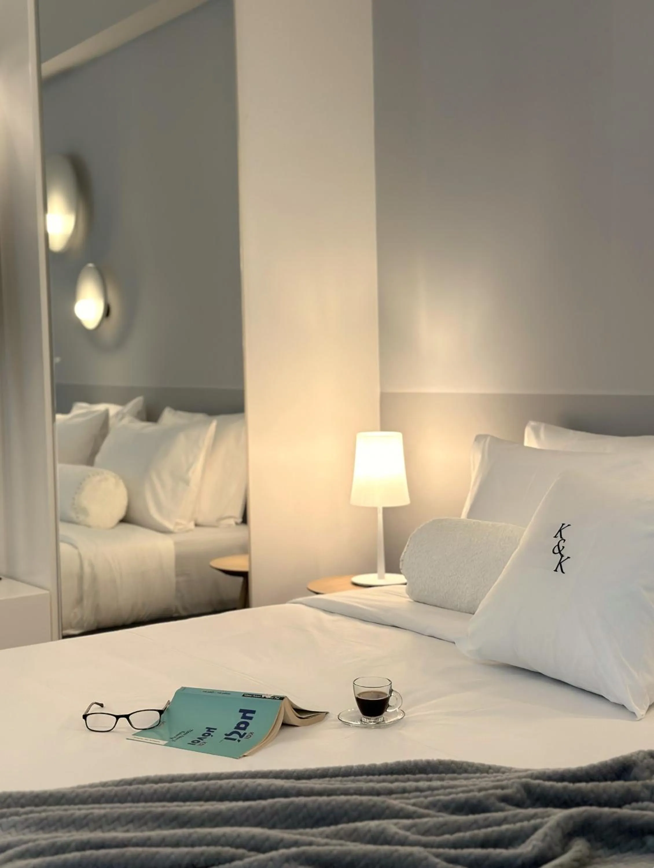 Bed in AIONION RESIDENCES by K&K