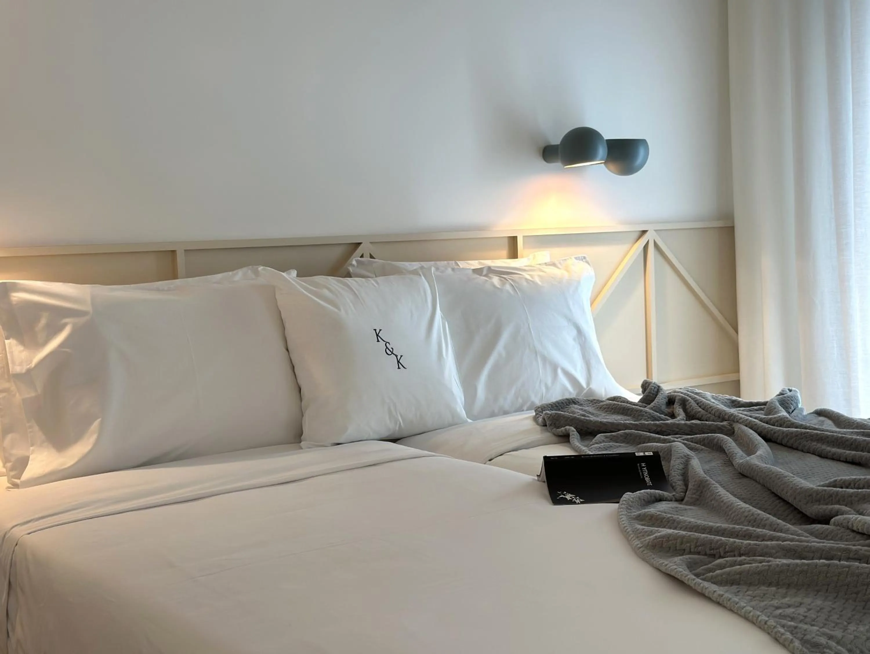 Bed in AIONION RESIDENCES by K&K