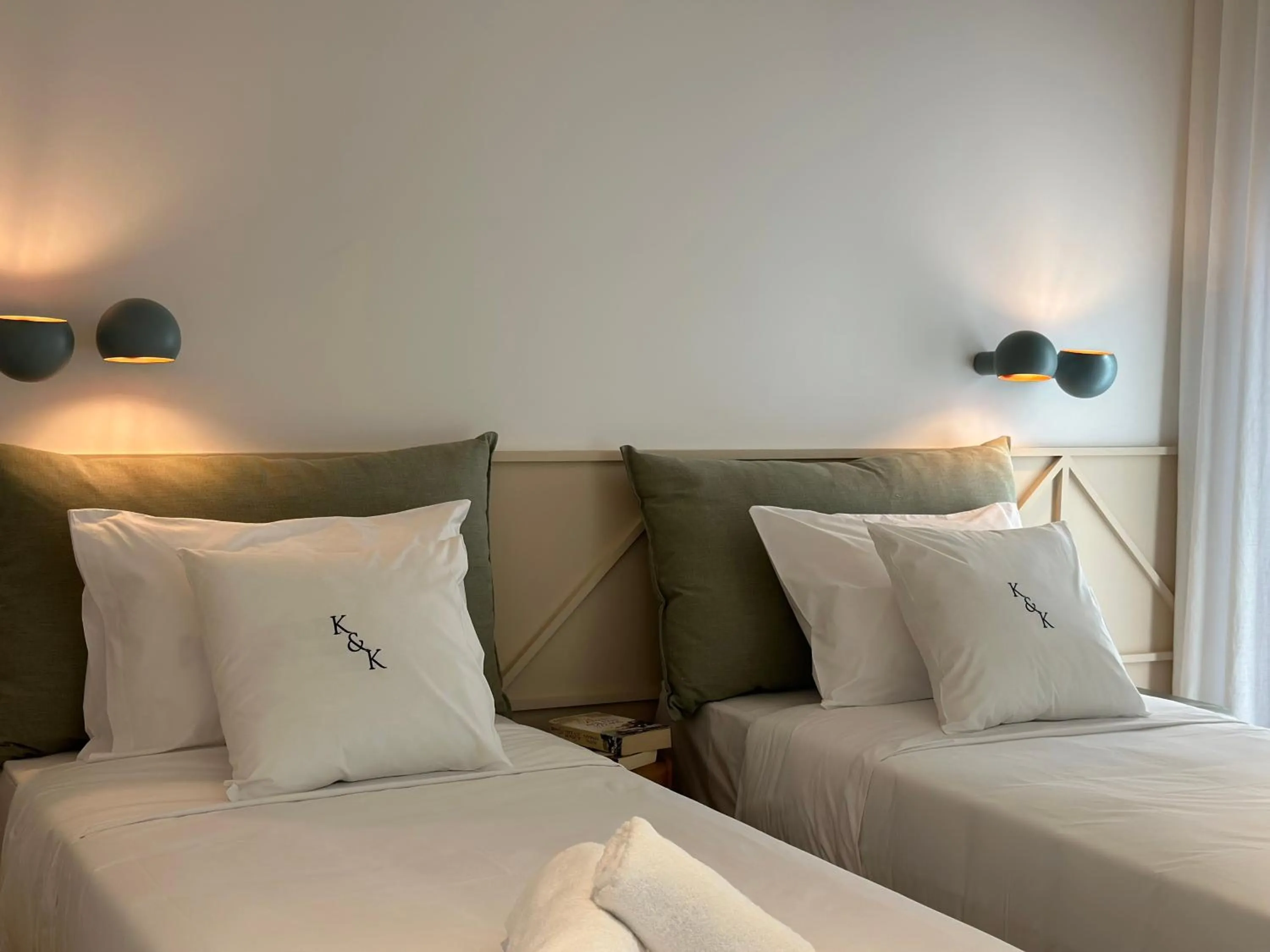 Bed in AIONION RESIDENCES by K&K