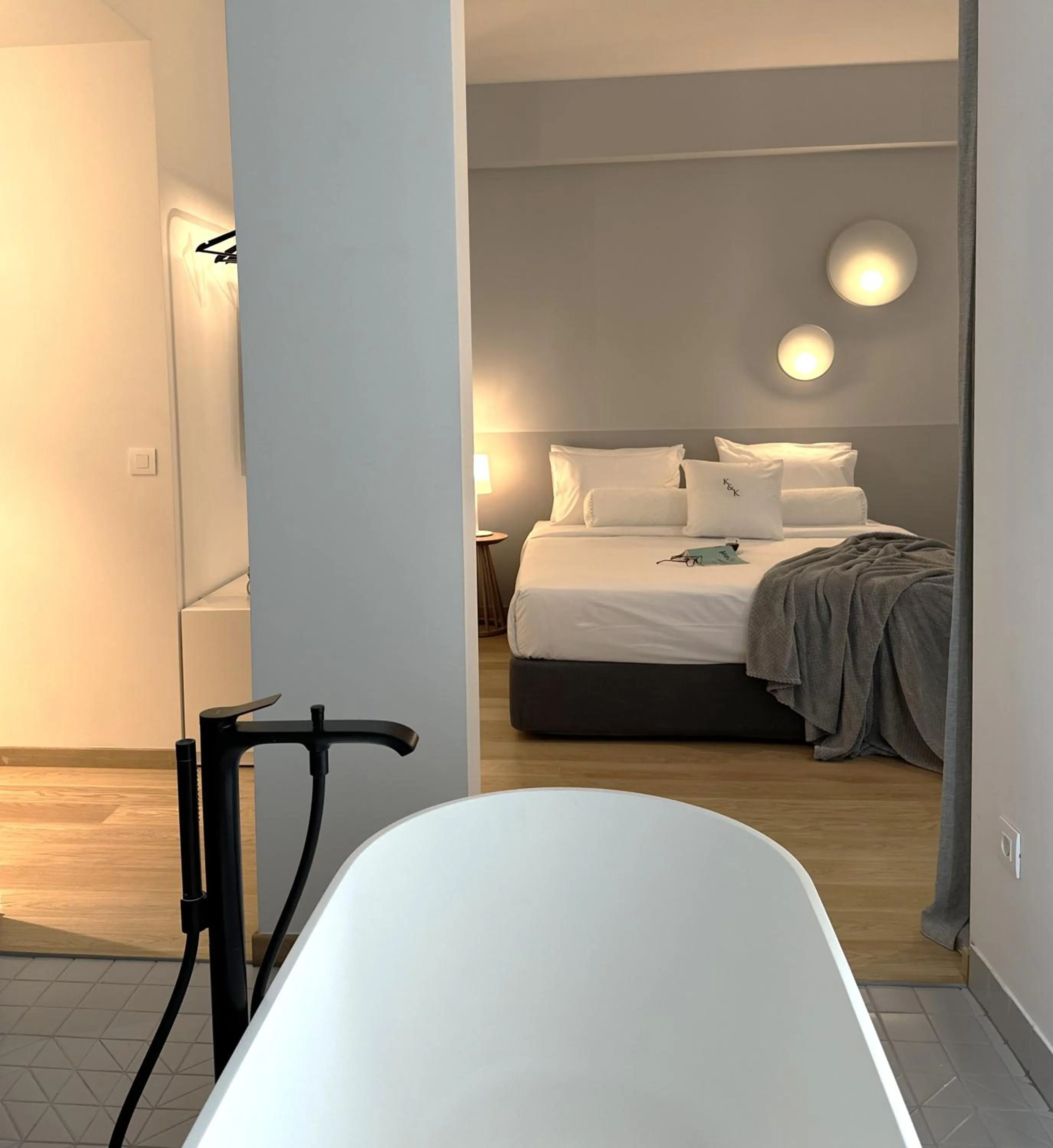 Bed in AIONION RESIDENCES by K&K