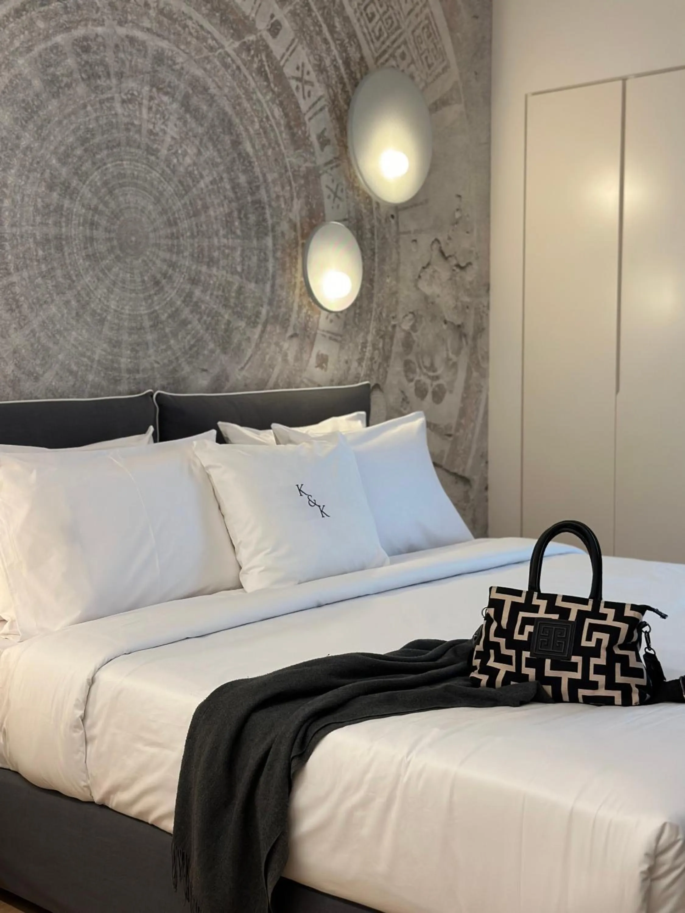 Bed in AIONION RESIDENCES by K&K