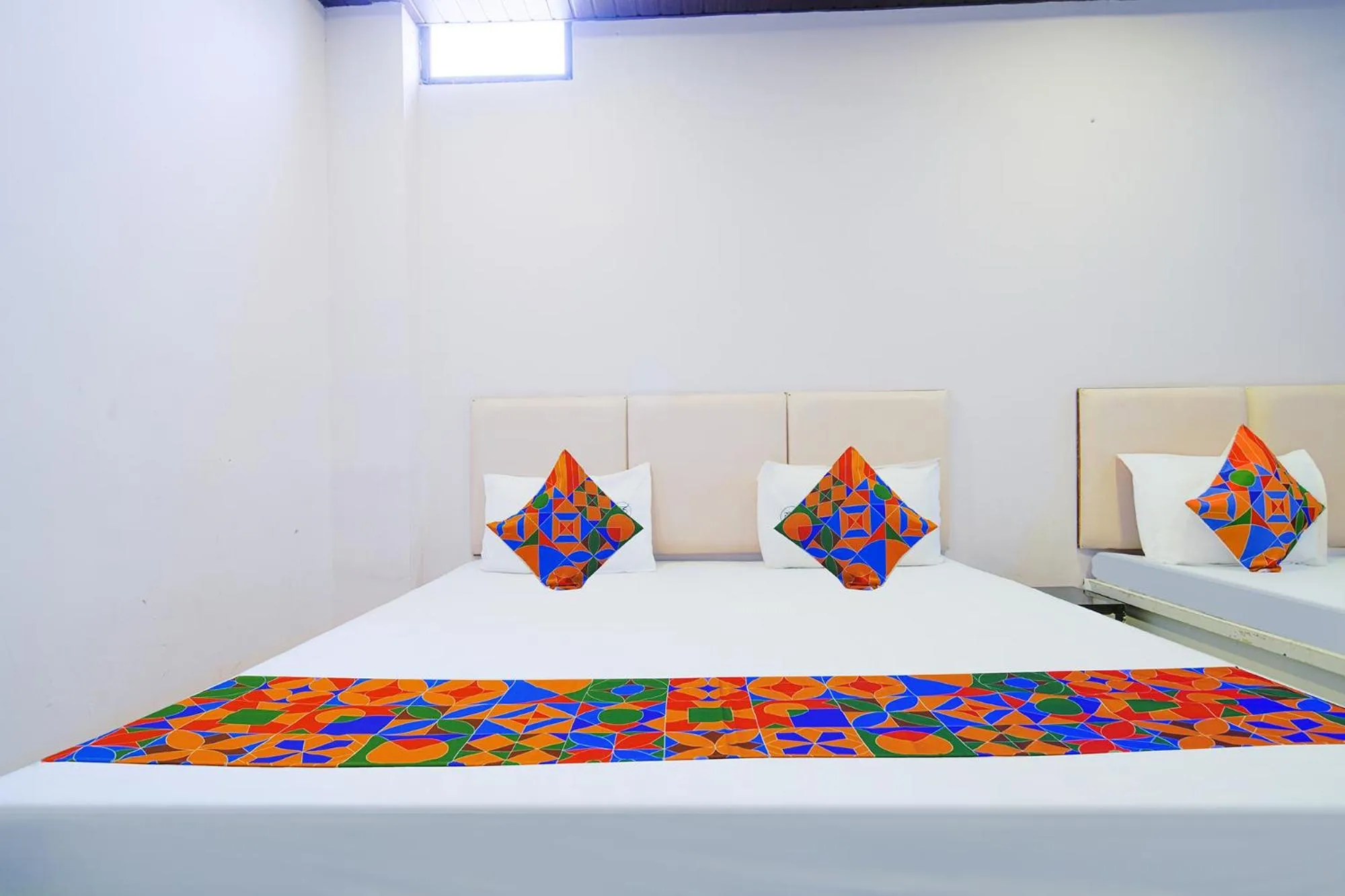 Bed in FabHotel Shree Moti Palace