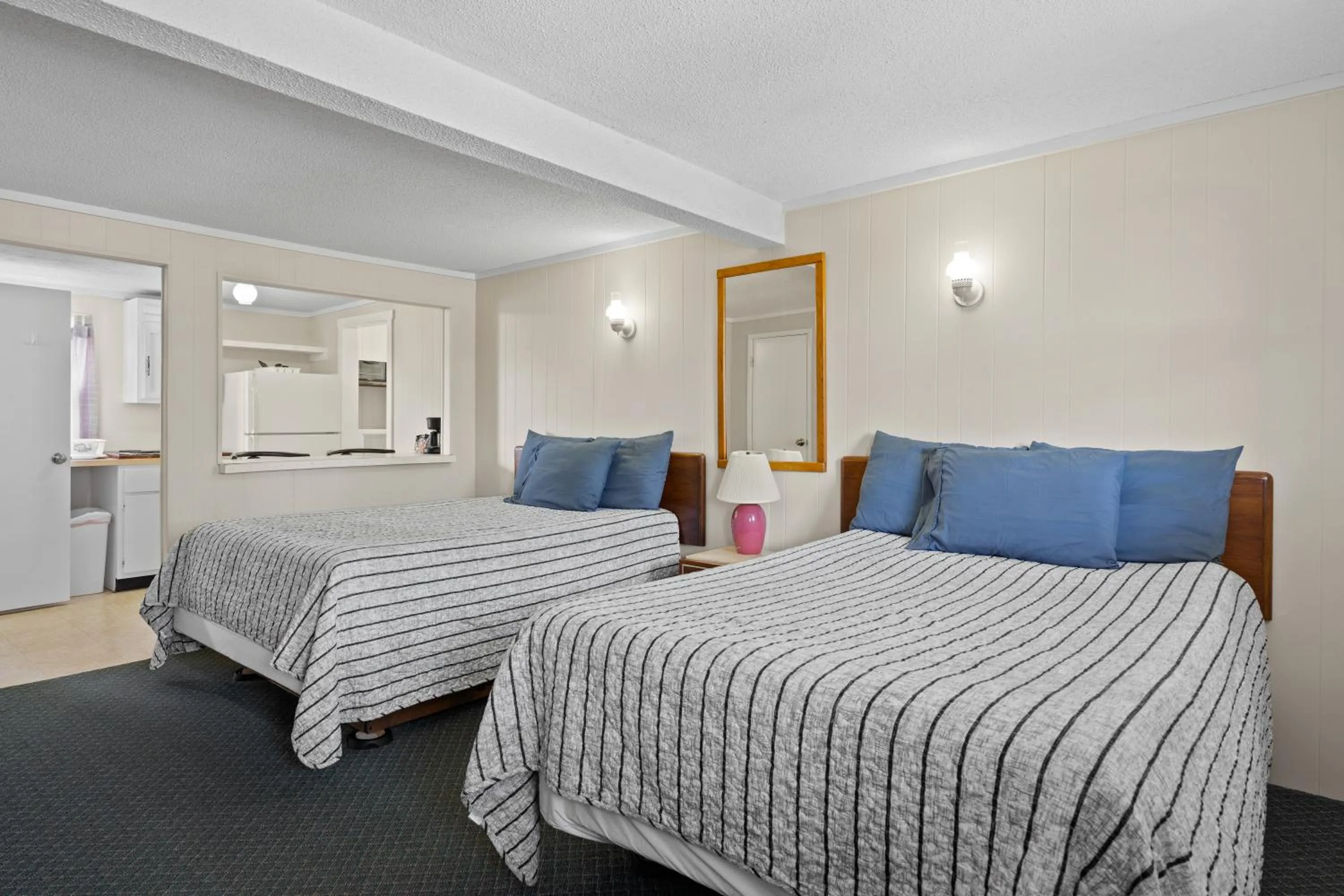 Bed in Beach Motel and Suites