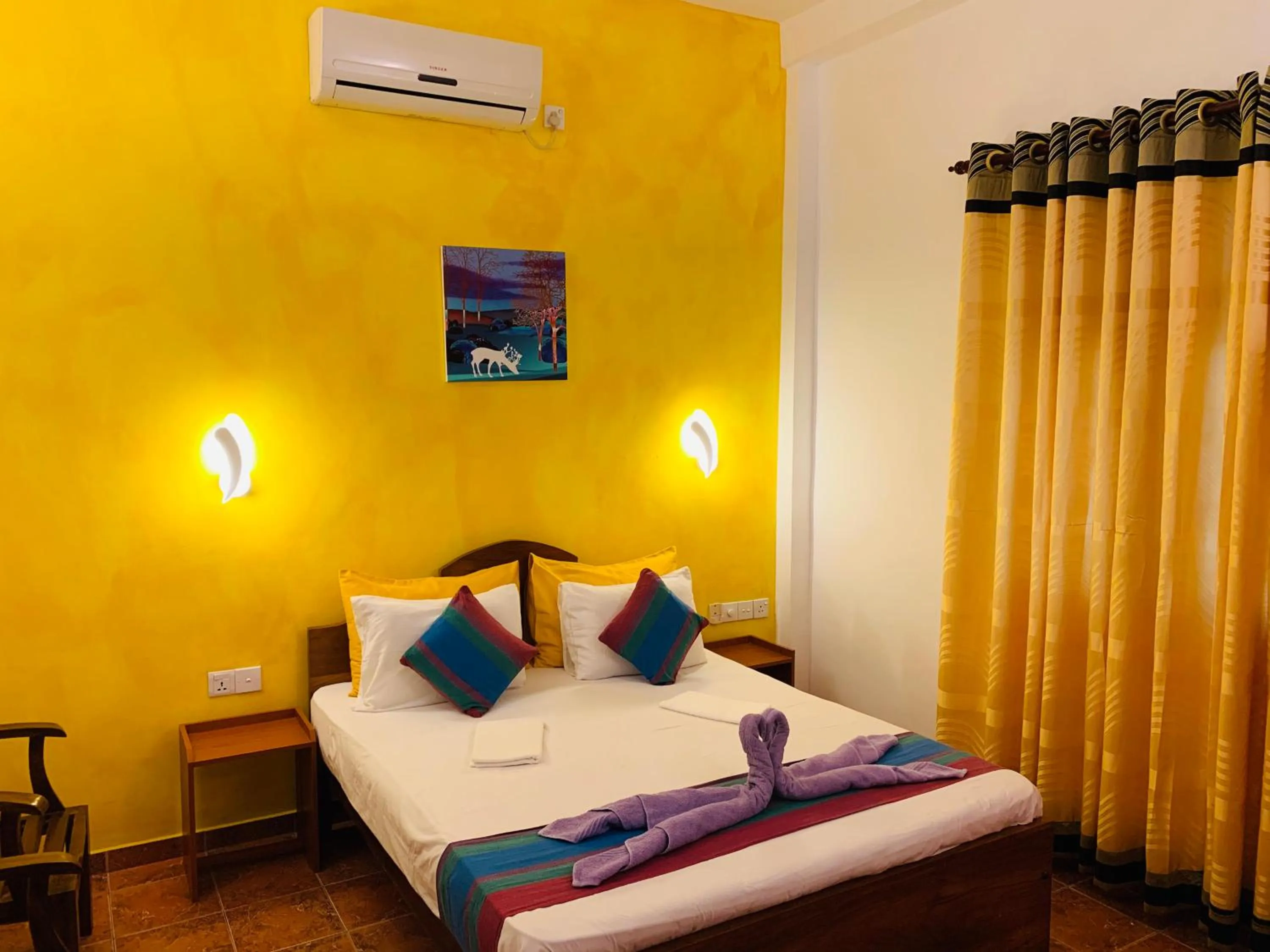 Bed in Sam's Guest House