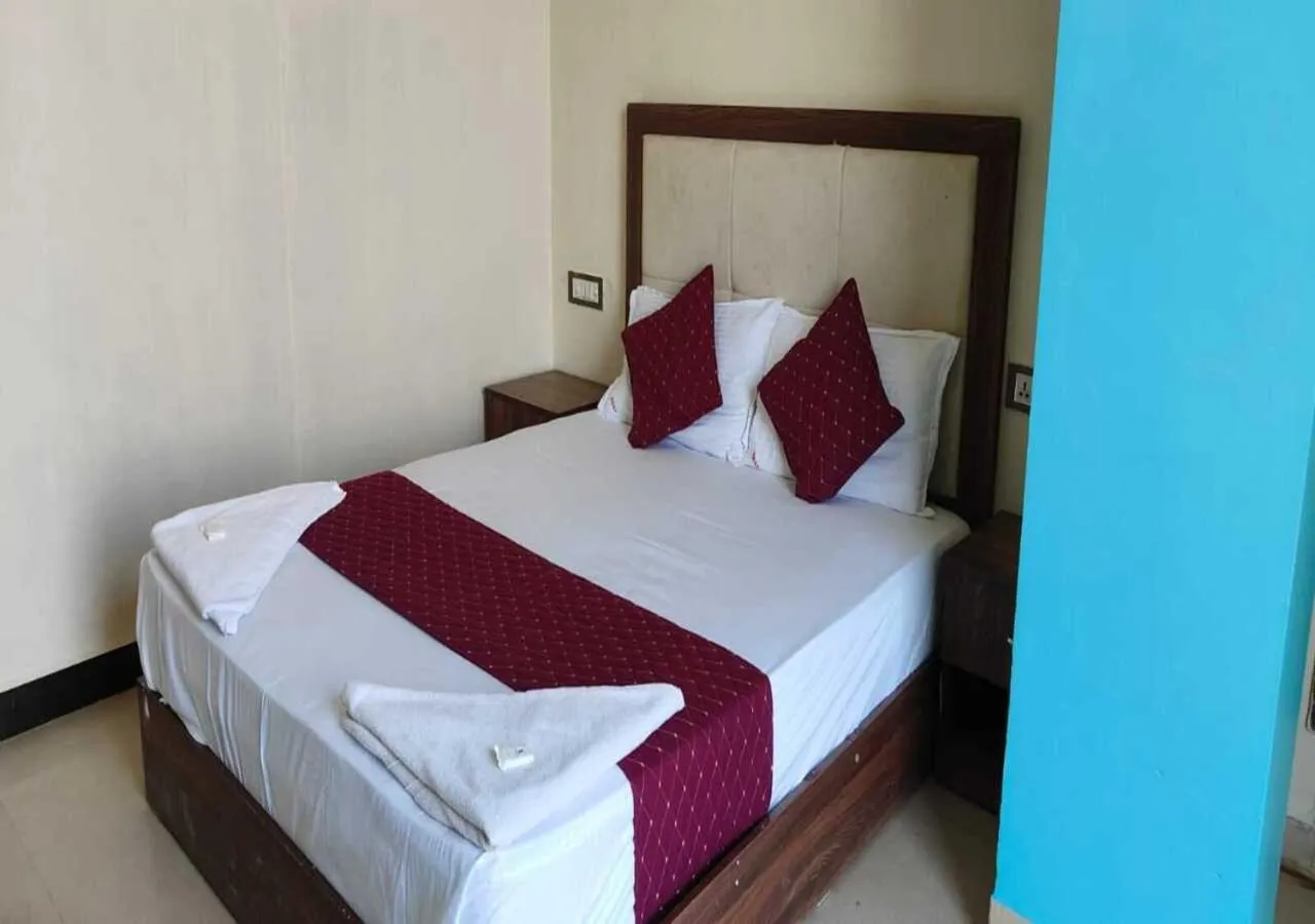 Bed in Hotel Blue Sky Residency