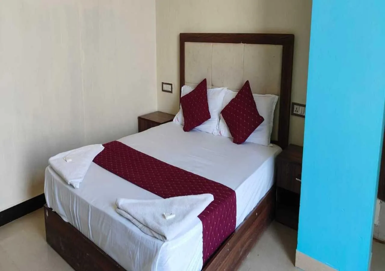 Bed in Hotel Blue Sky Residency