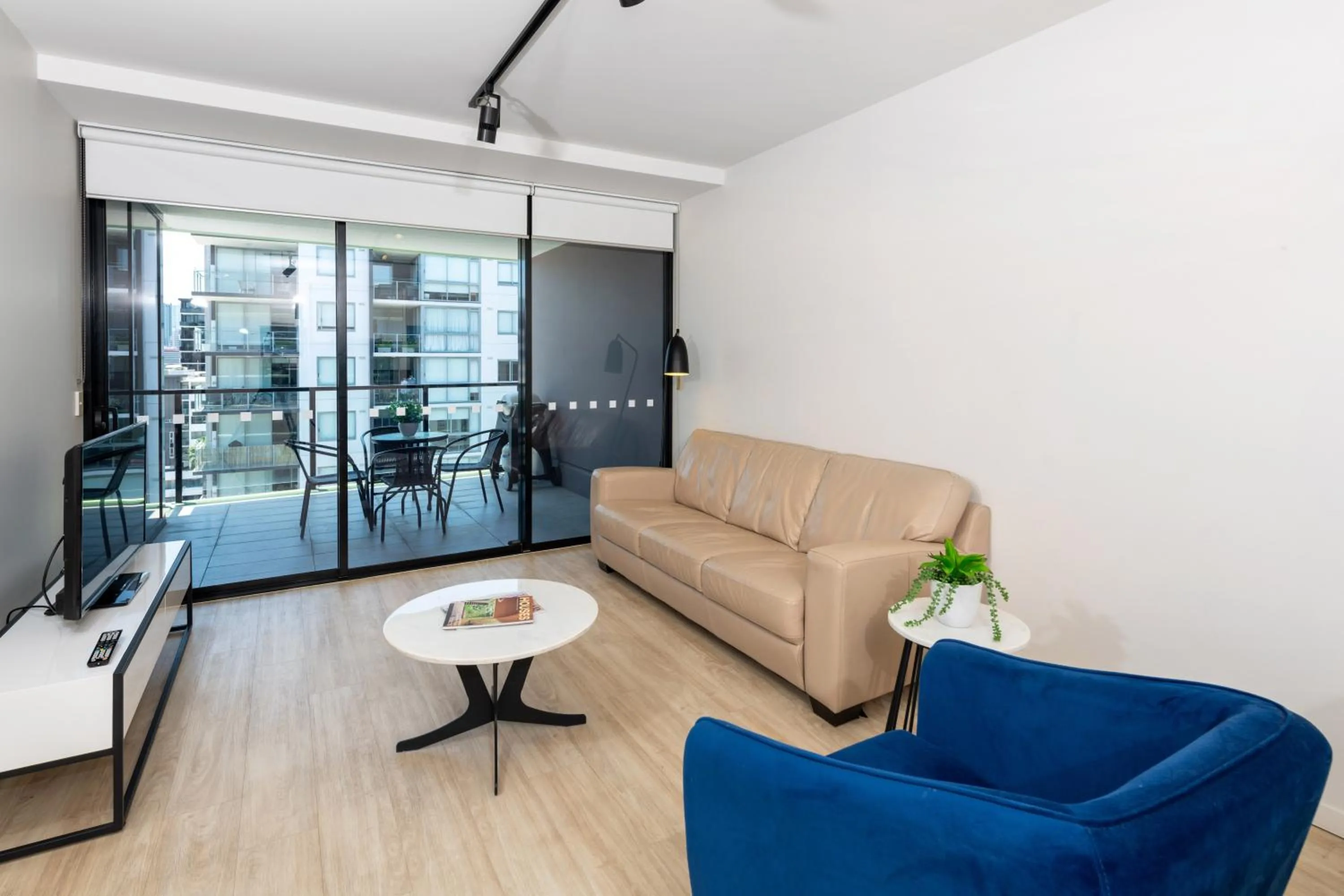 Living room in Arena Apartments by CLLIX