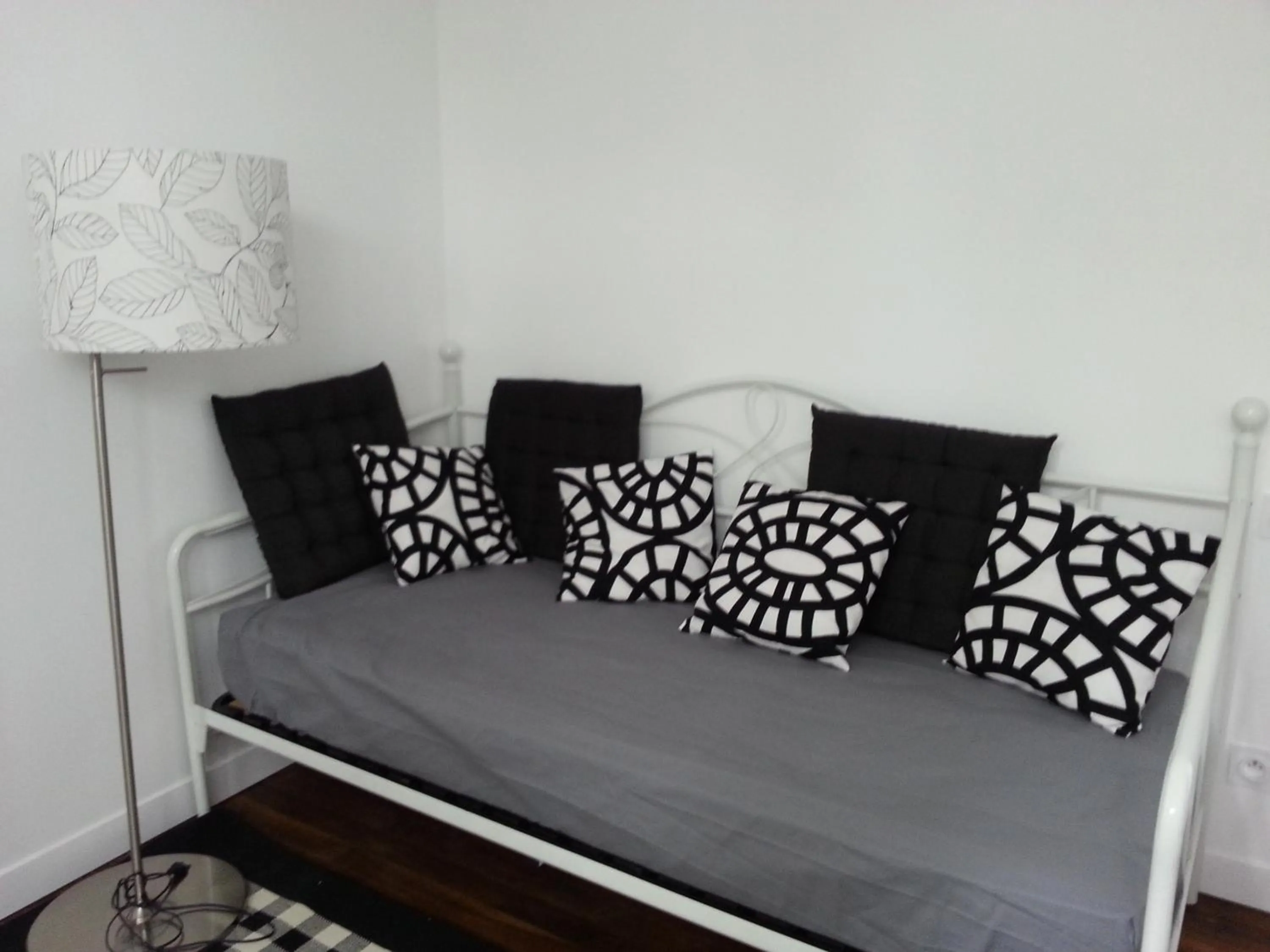 Seating area, Bed in HÔTEL Le 6 3 Home PORT EN BESSIN Parking privé gratuit