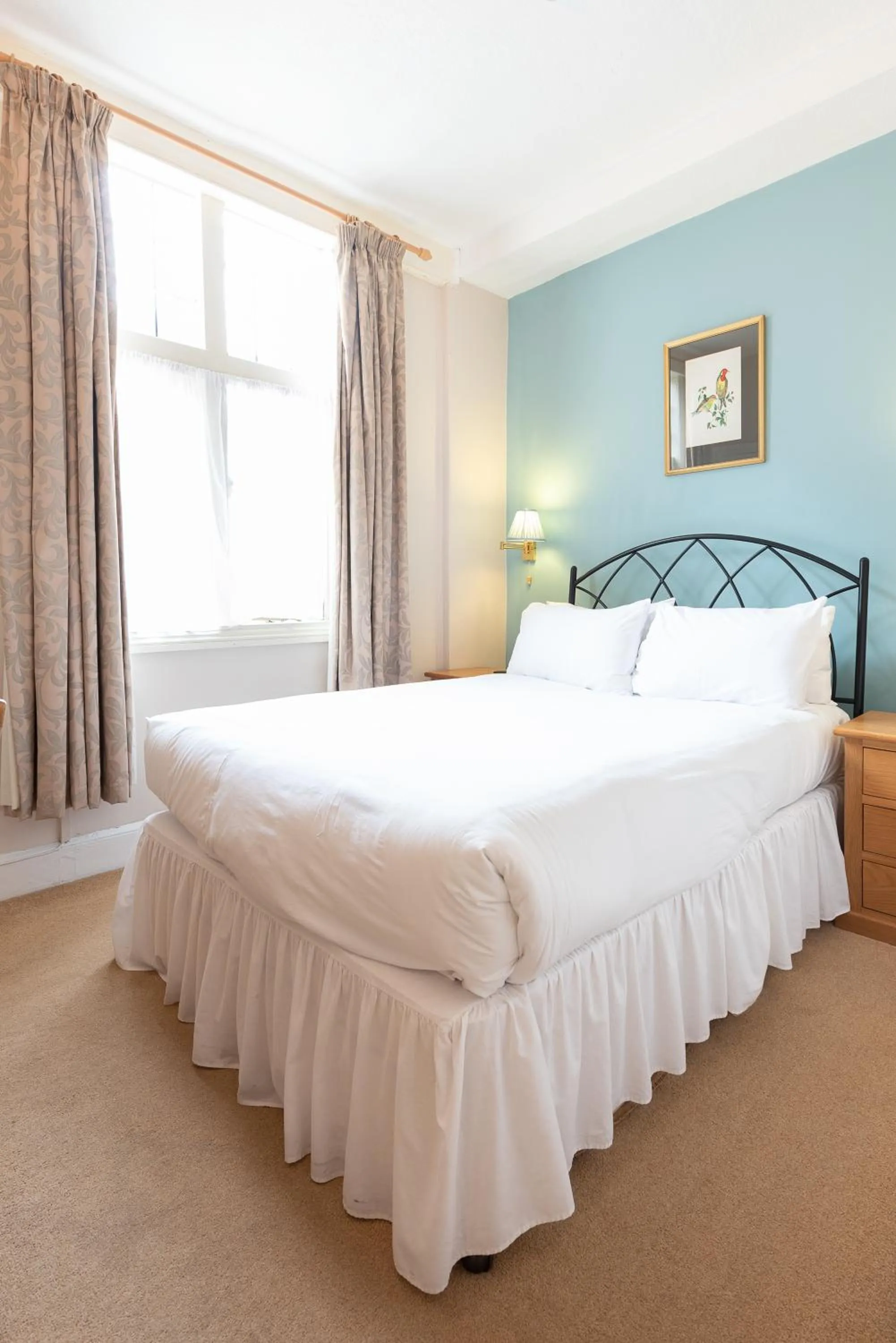 Bed in Corinium Hotel & Restaurant