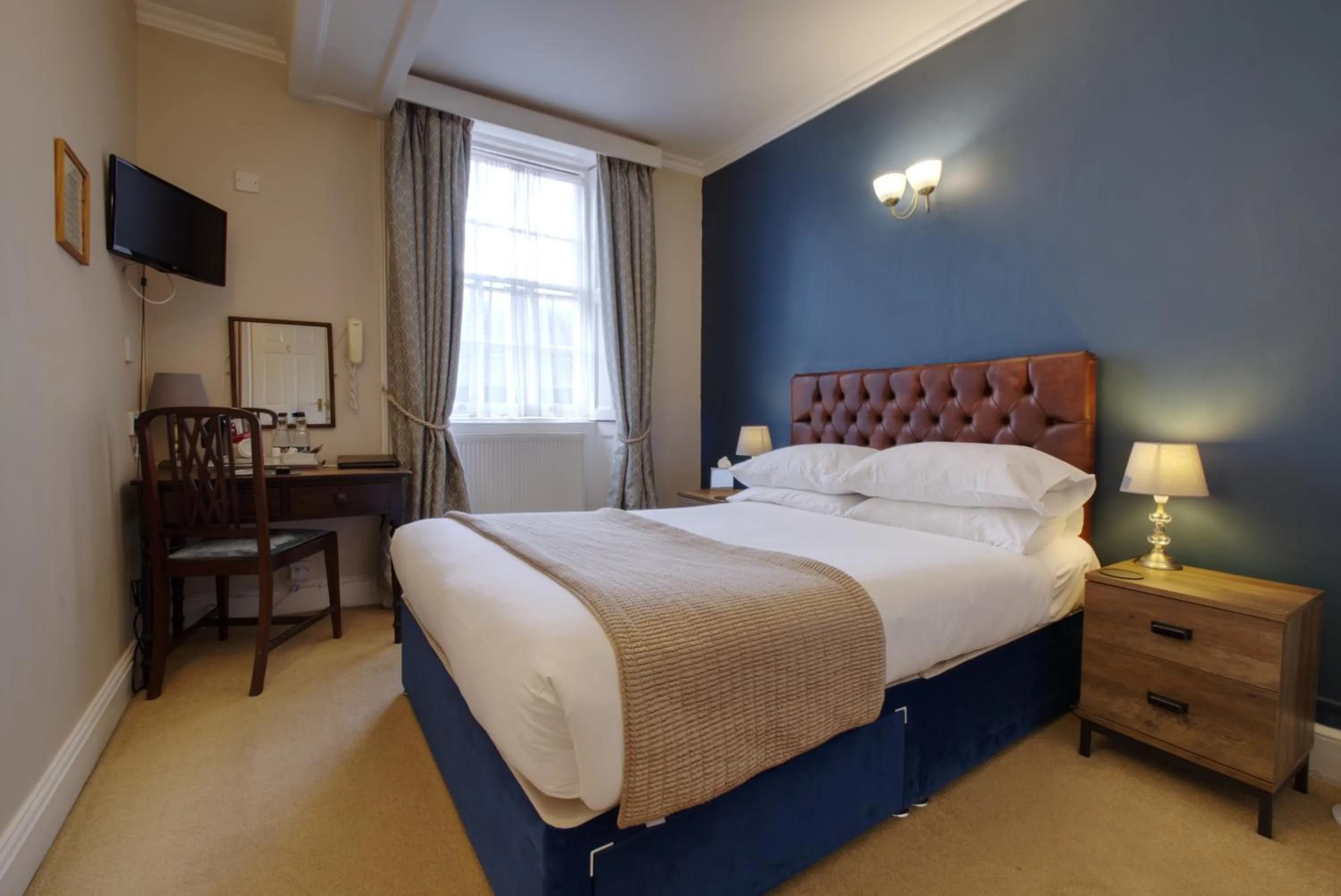 Bed in Corinium Hotel & Restaurant