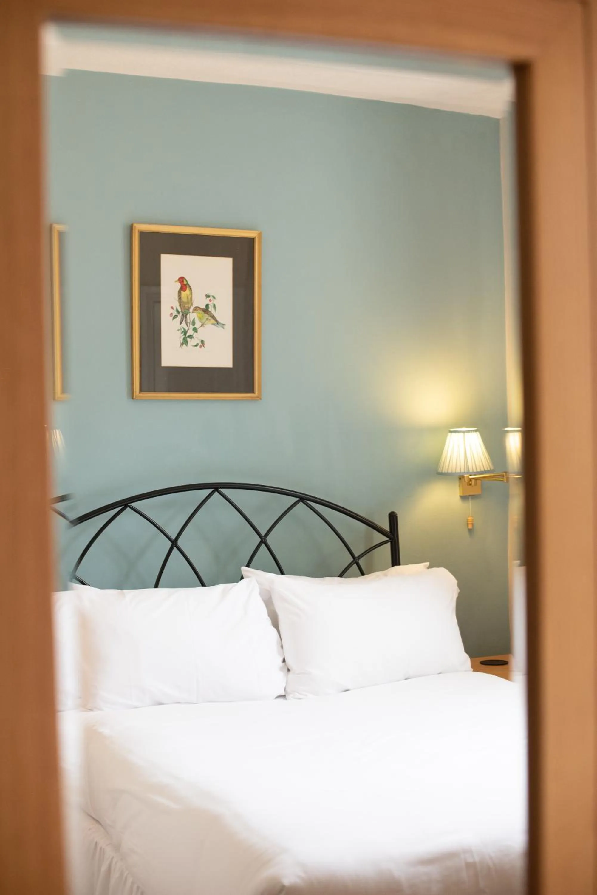 Bed in Corinium Hotel & Restaurant