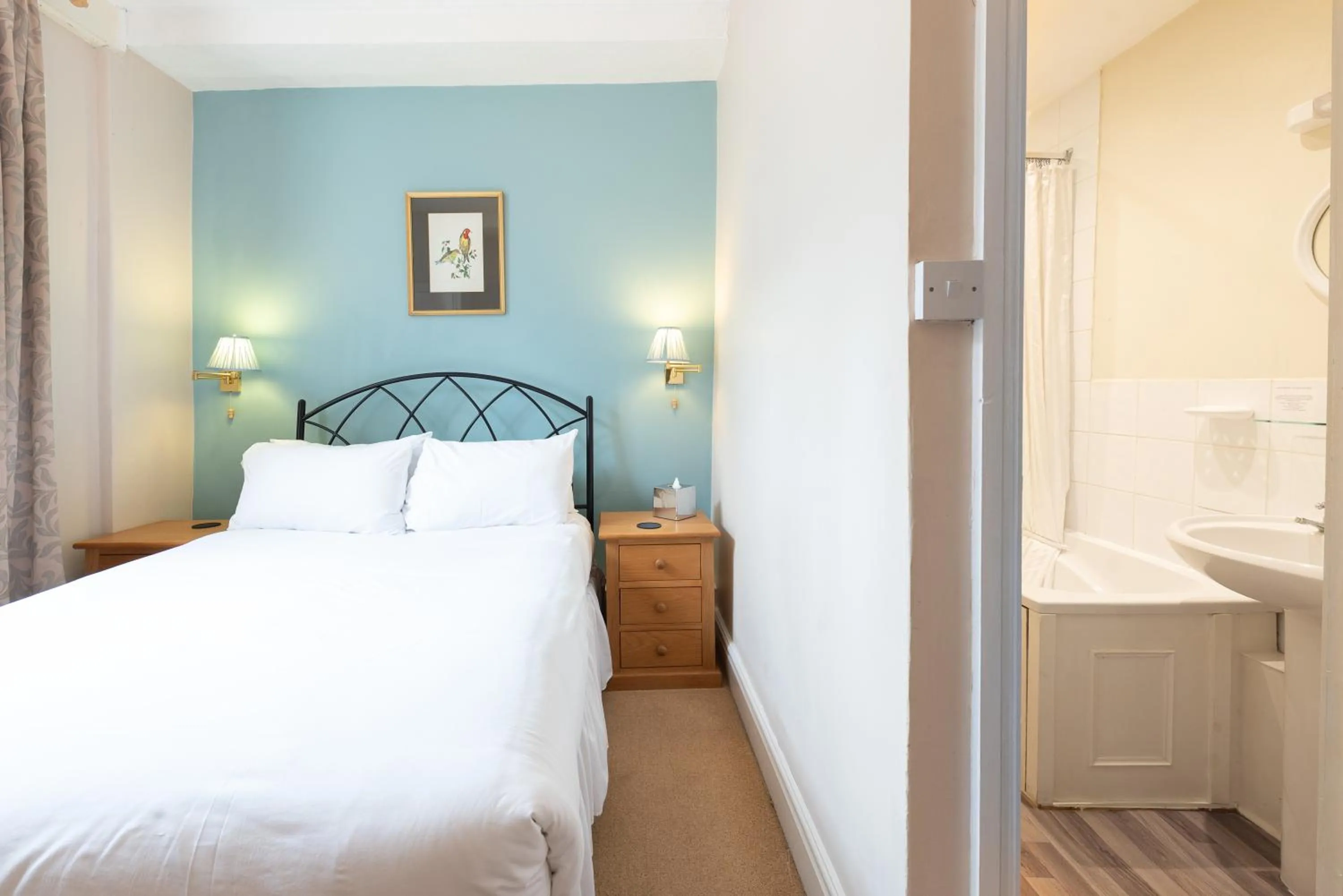 Bed in Corinium Hotel & Restaurant