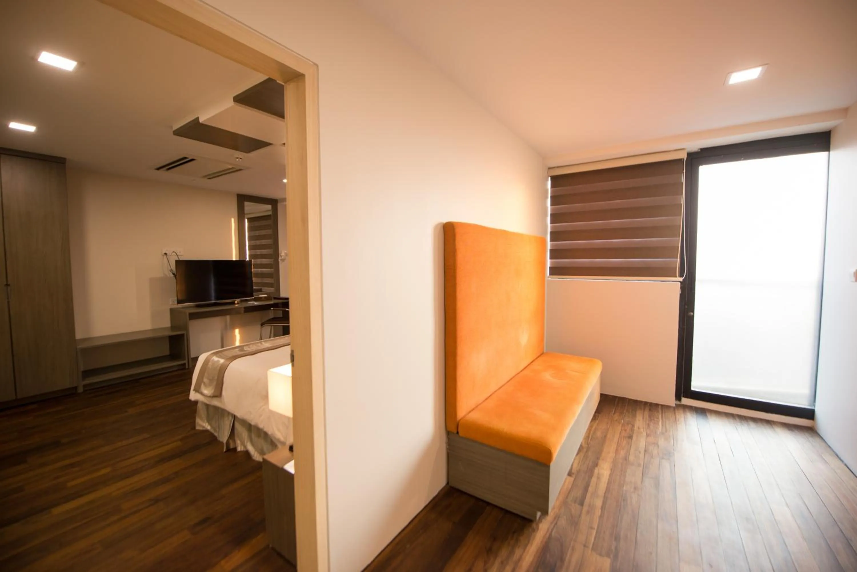 Seating area, Bed in Hotel Parami