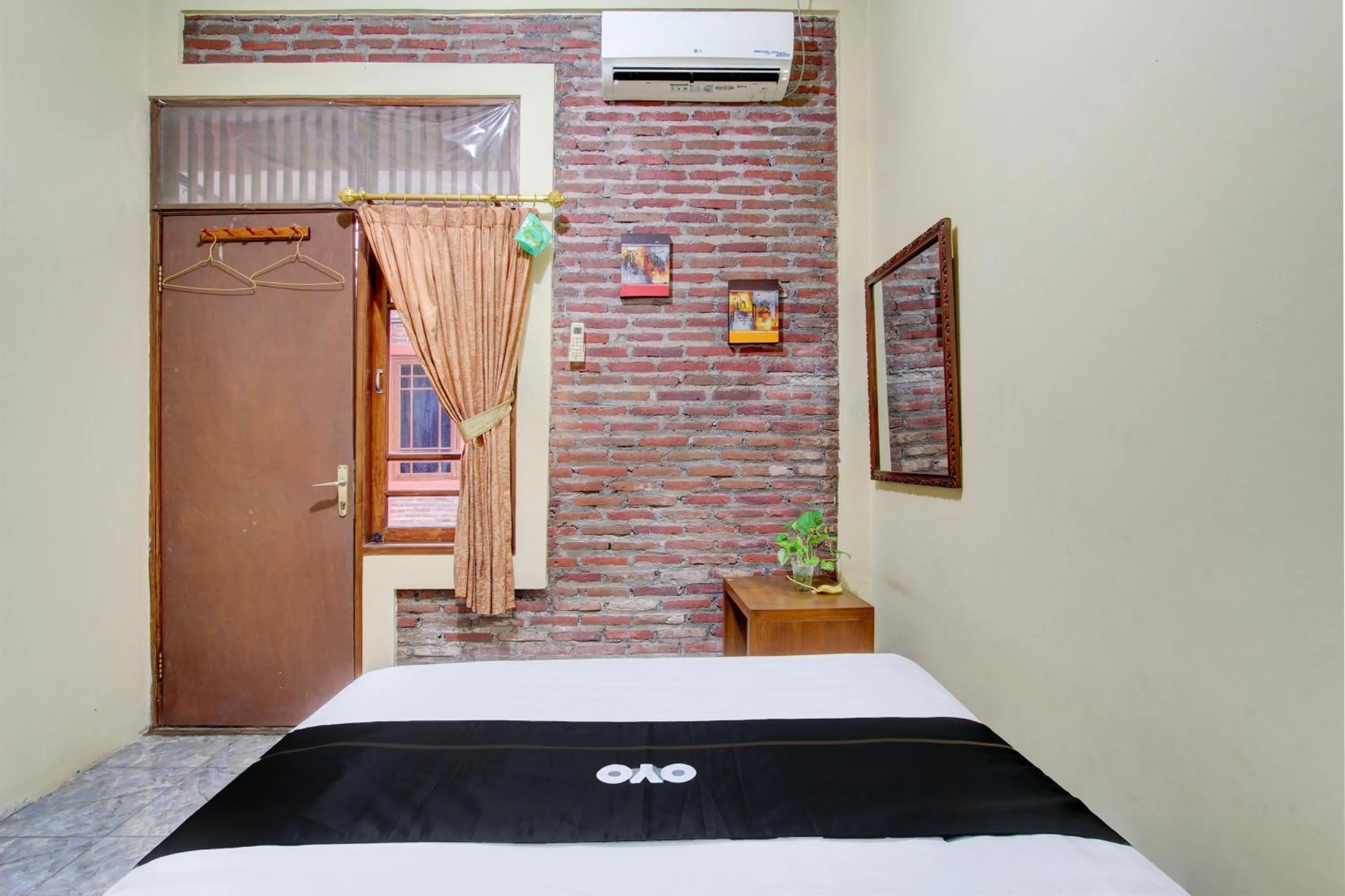 Bedroom in Capital O 93716 Family Guesthouse Syariah