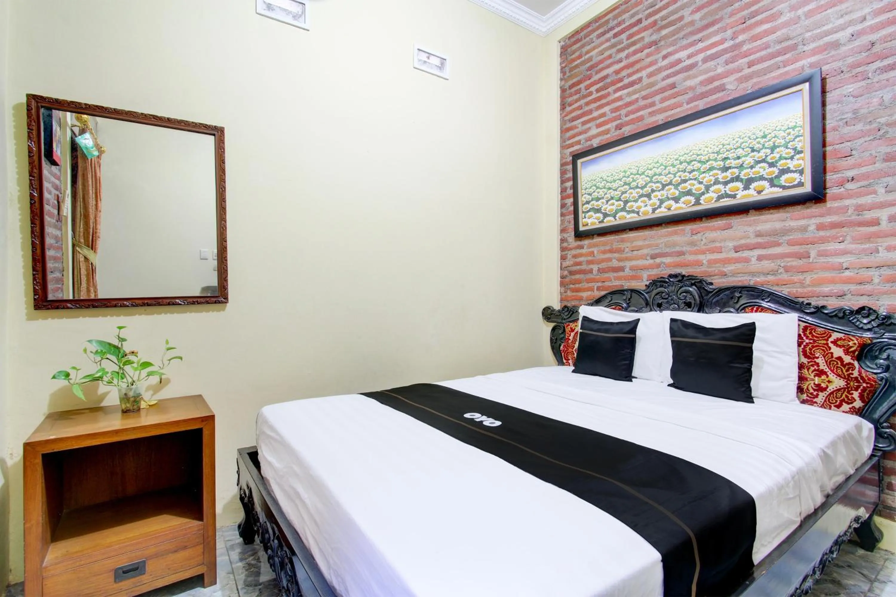 Bedroom in Capital O 93716 Family Guesthouse Syariah