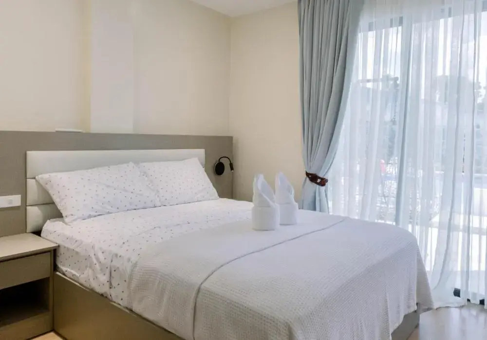 Bed in Sonrisa Resort De Playa by Hiverooms Bed in Sonrisa Resort De Playa by Hiverooms