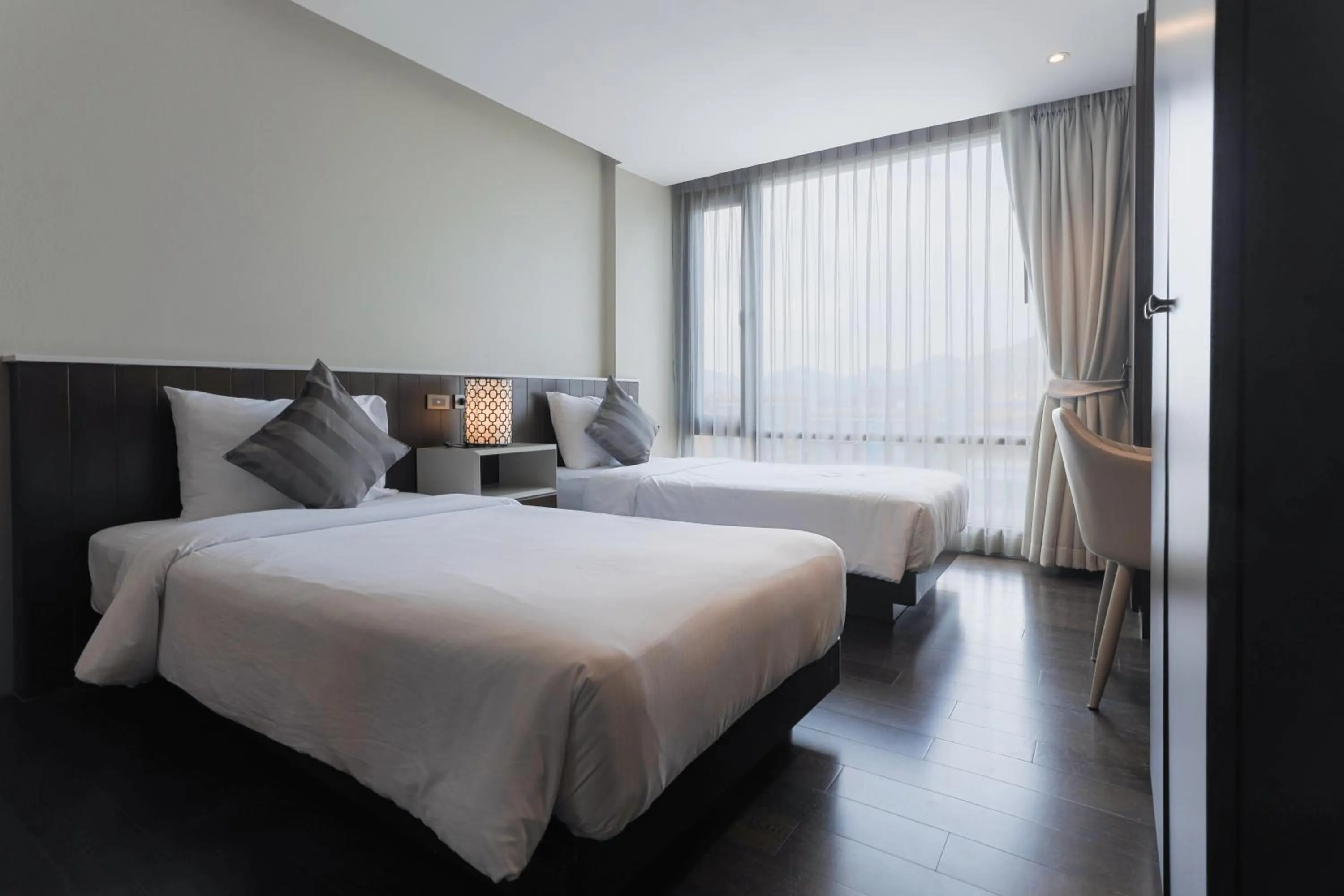 Bed in Balcony Courtyard Sriracha Hotel & Serviced Apartments