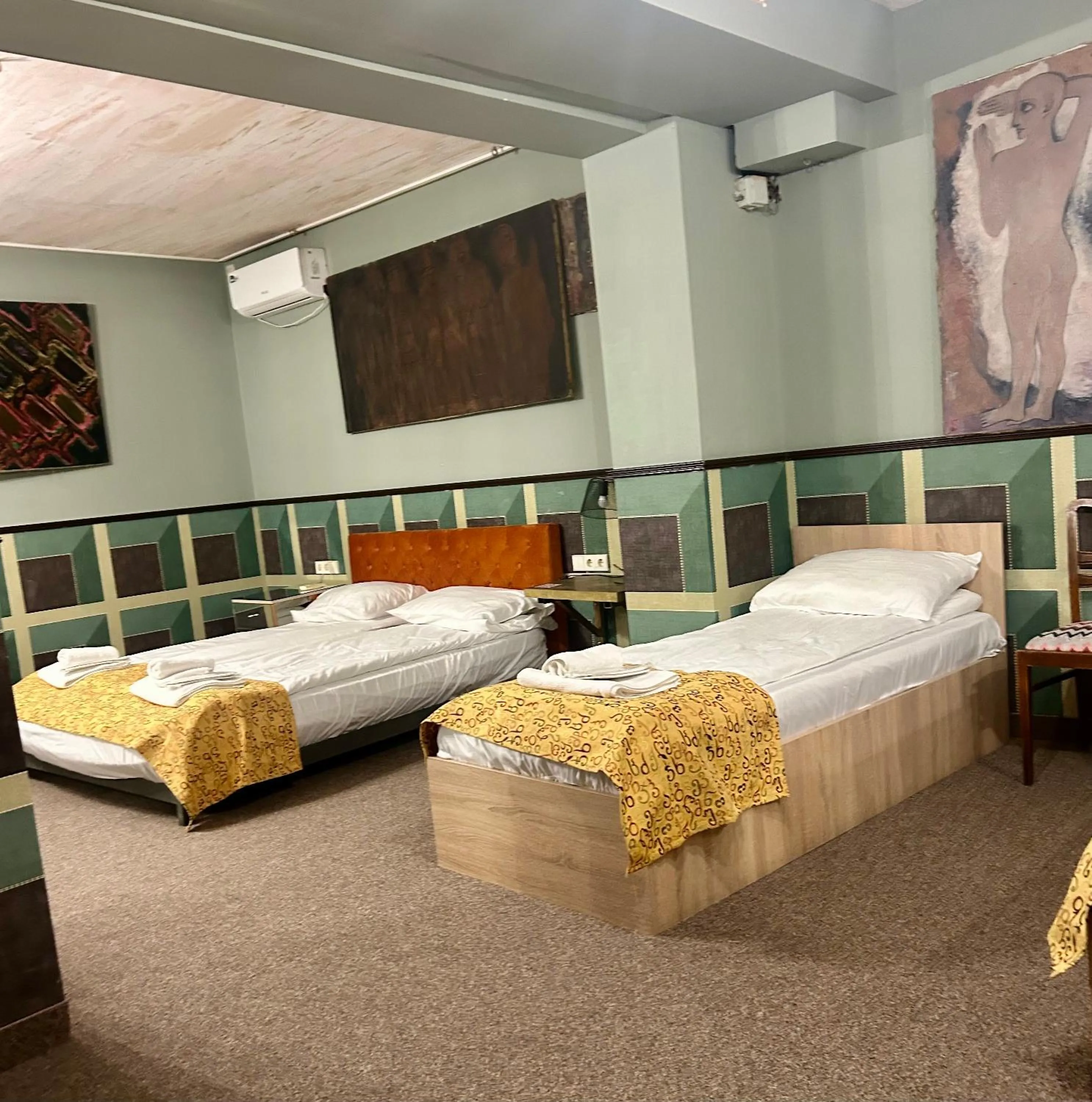 Bed in Art Hotel Home