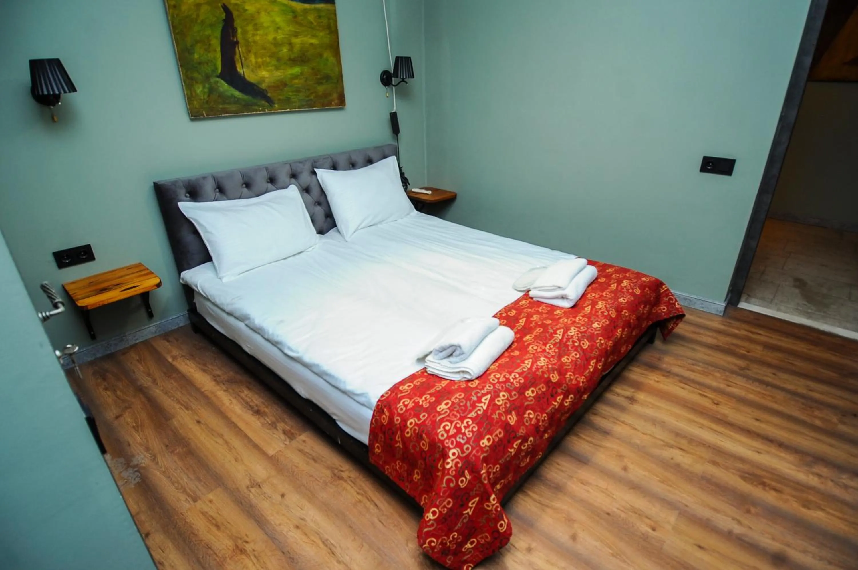 Bed in Art Hotel Home