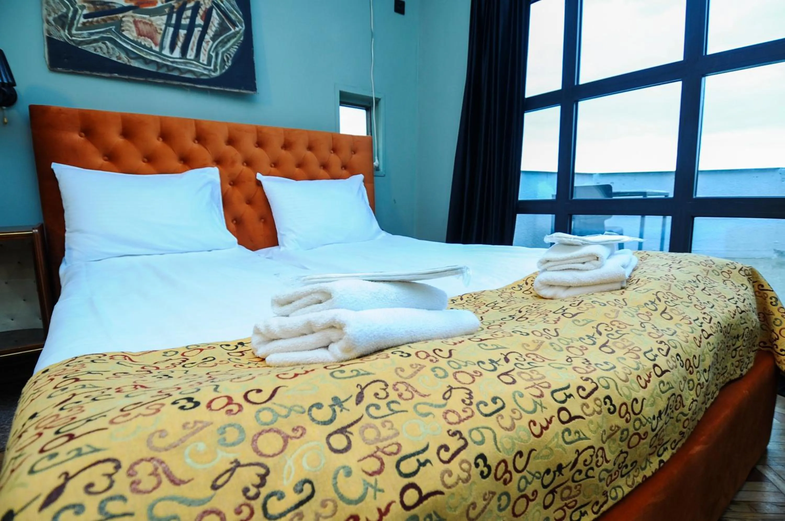 Bed in Art Hotel Home