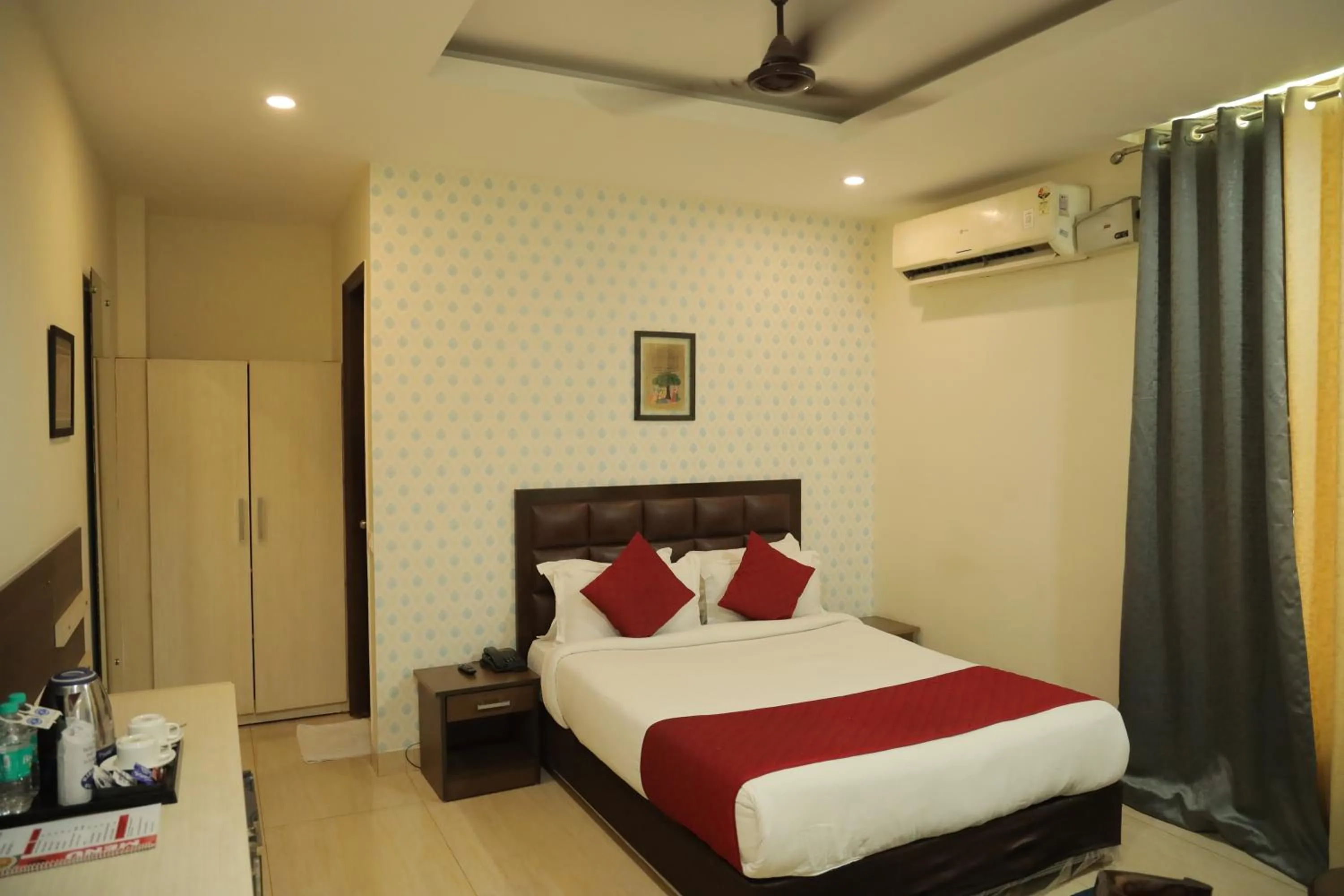 Bed in Hotel Nirvana Suites