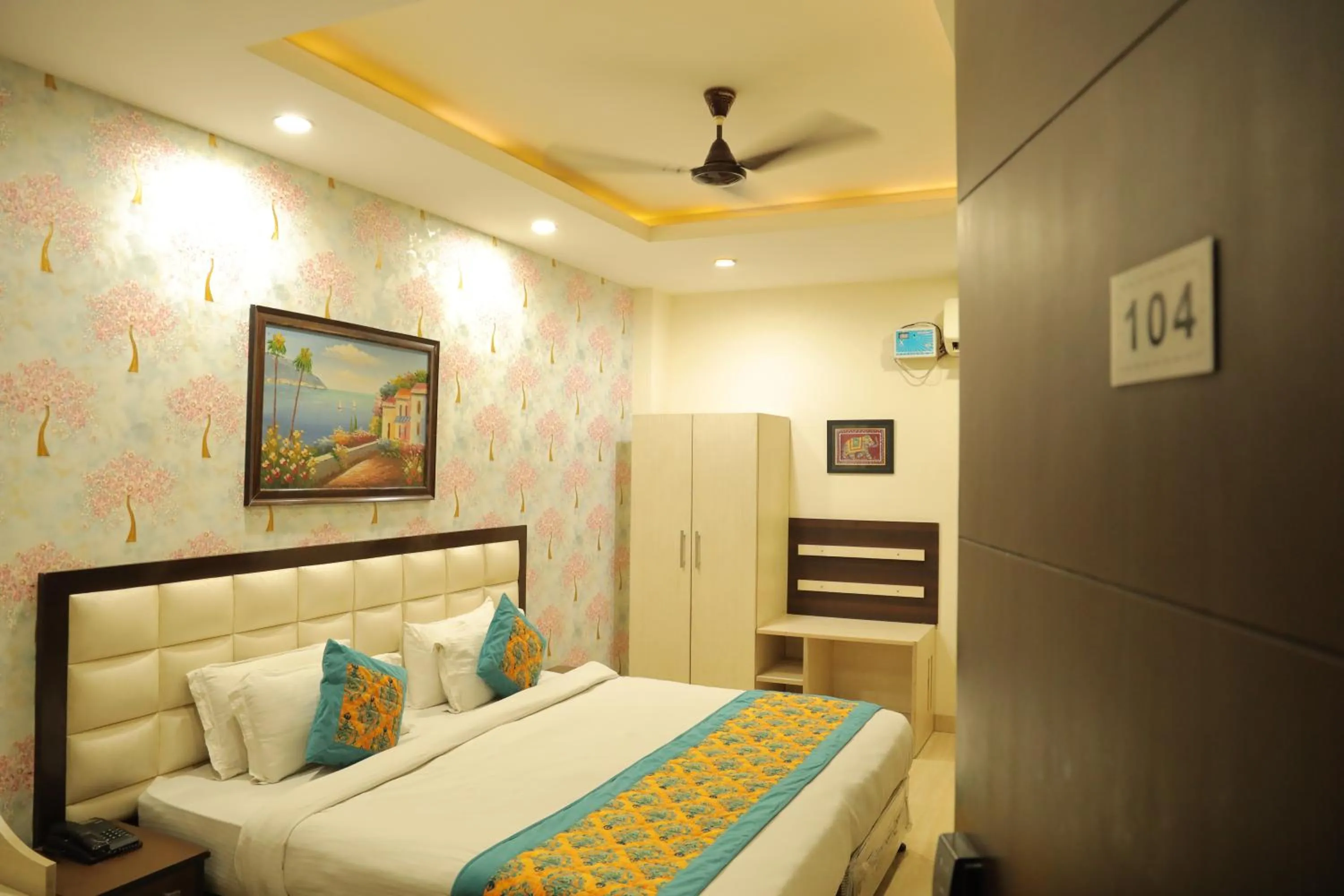 Bed in Hotel Nirvana Suites