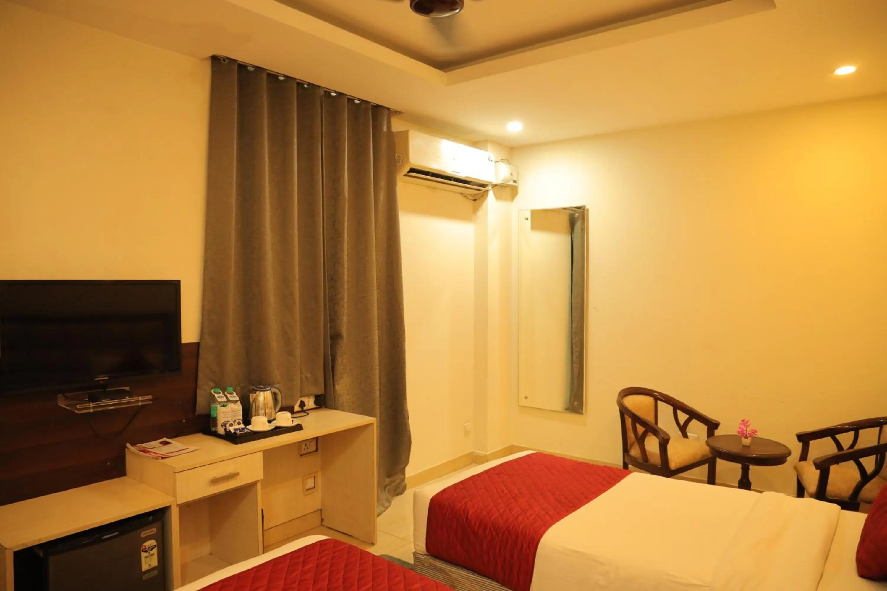 Bed in Hotel Nirvana Suites