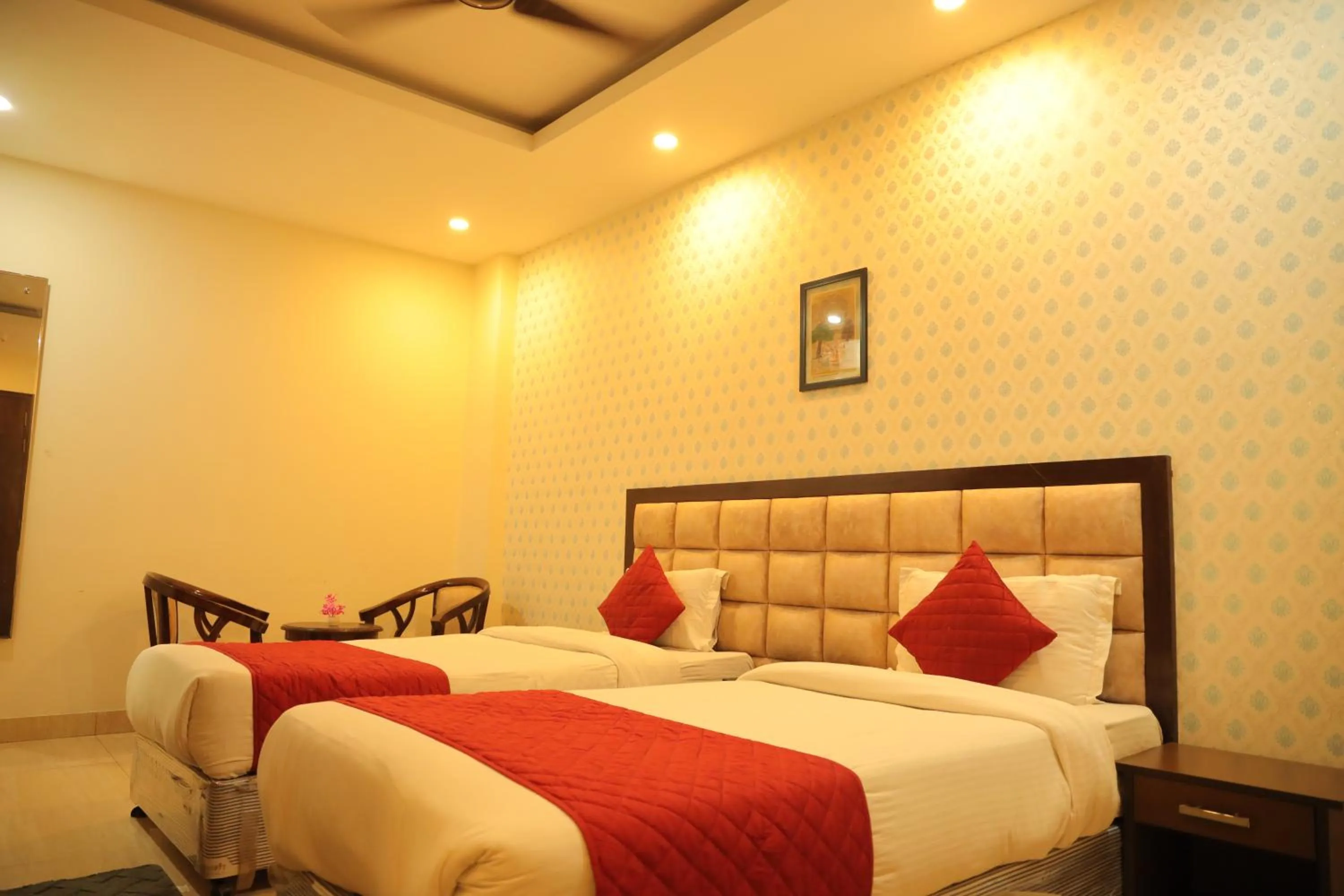 Bed in Hotel Nirvana Suites