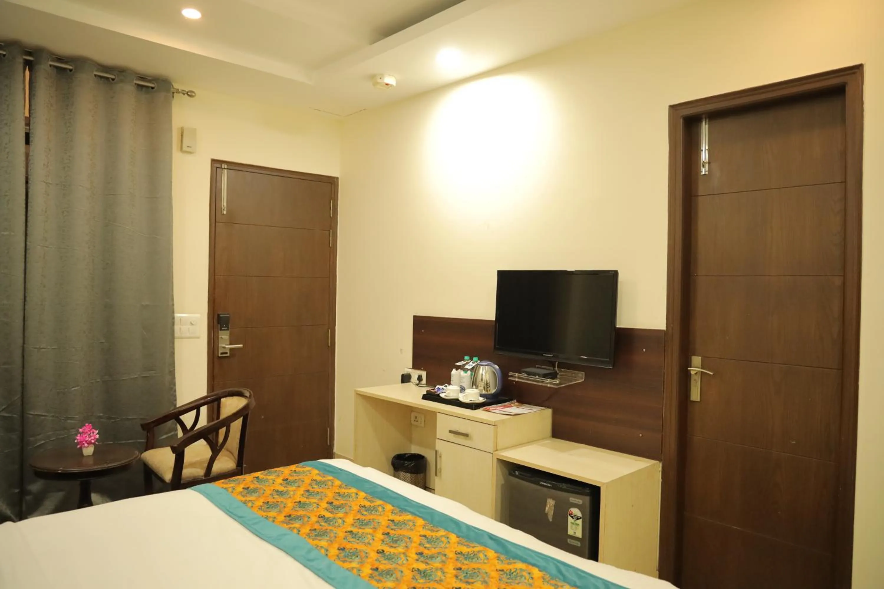 Bed in Hotel Nirvana Suites