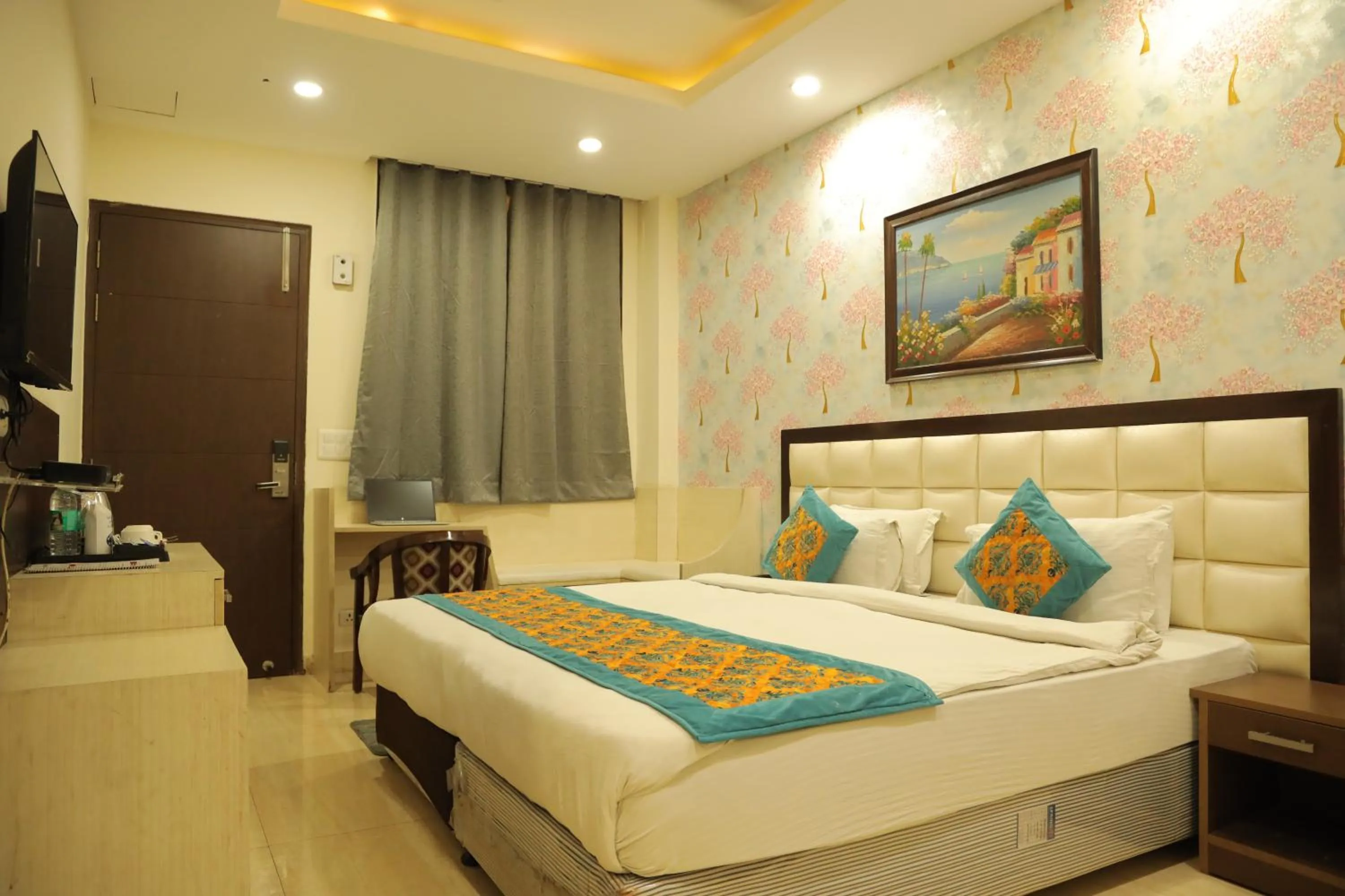 Bed in Hotel Nirvana Suites