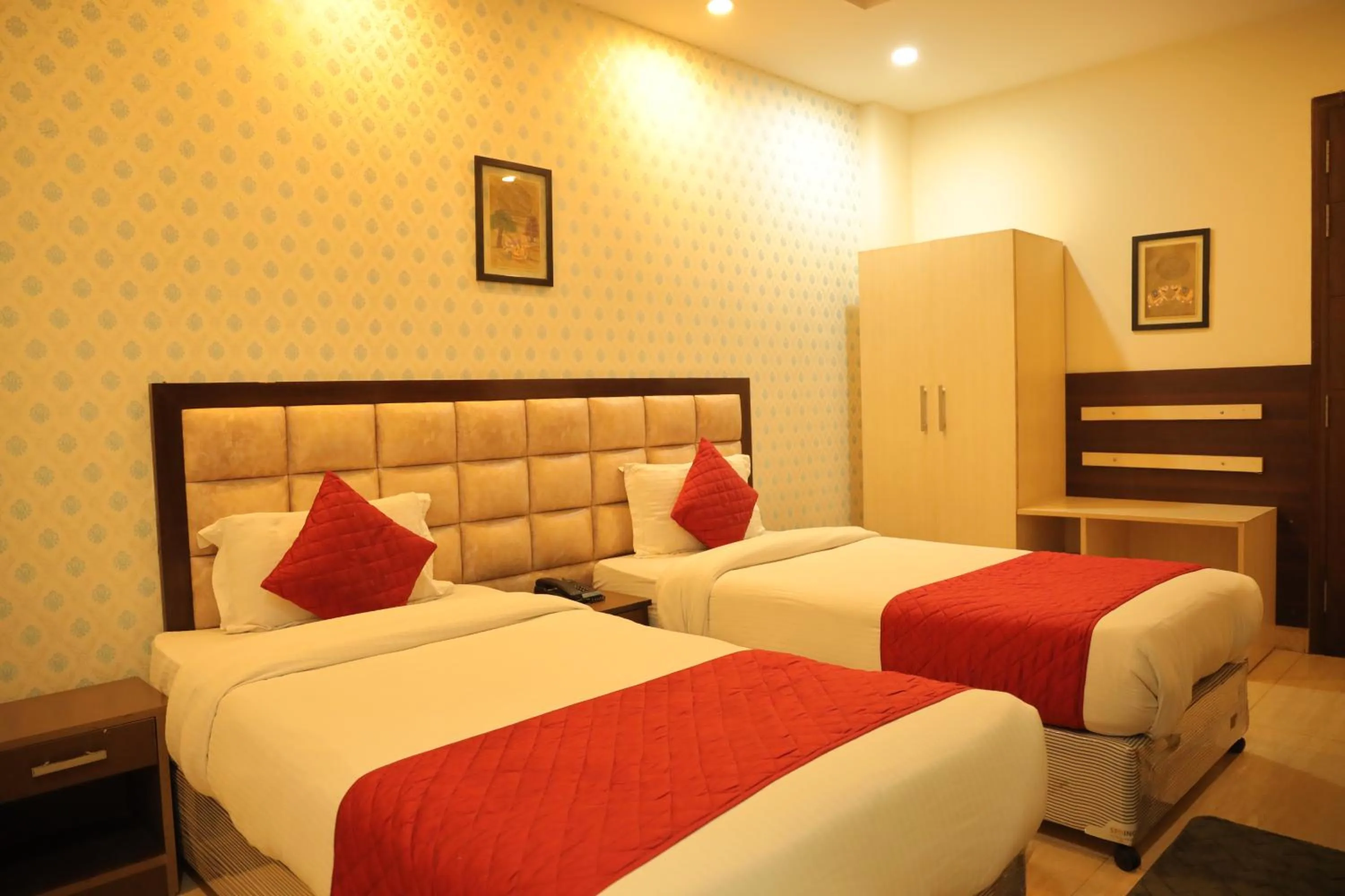 Bed in Hotel Nirvana Suites