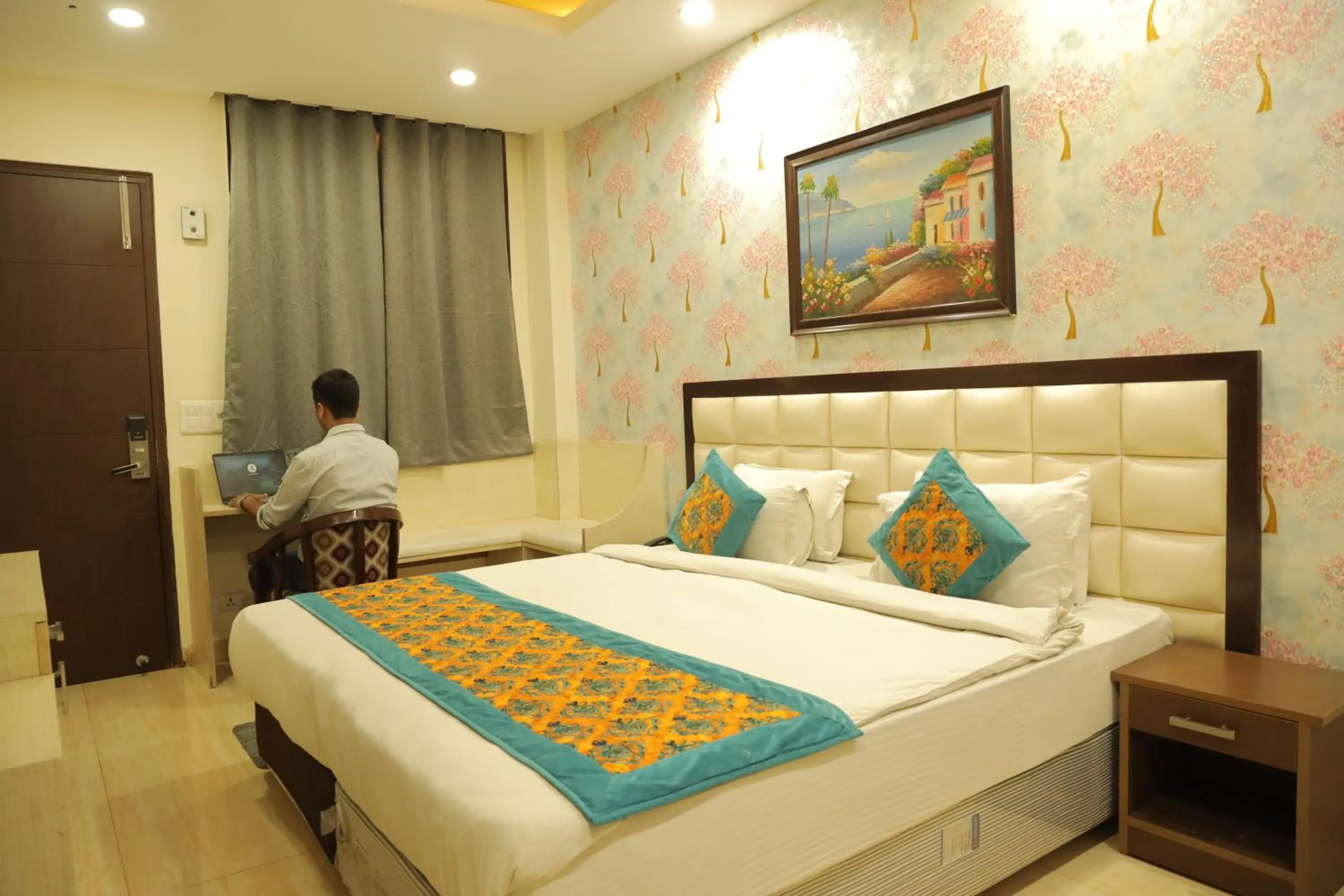 Bed in Hotel Nirvana Suites