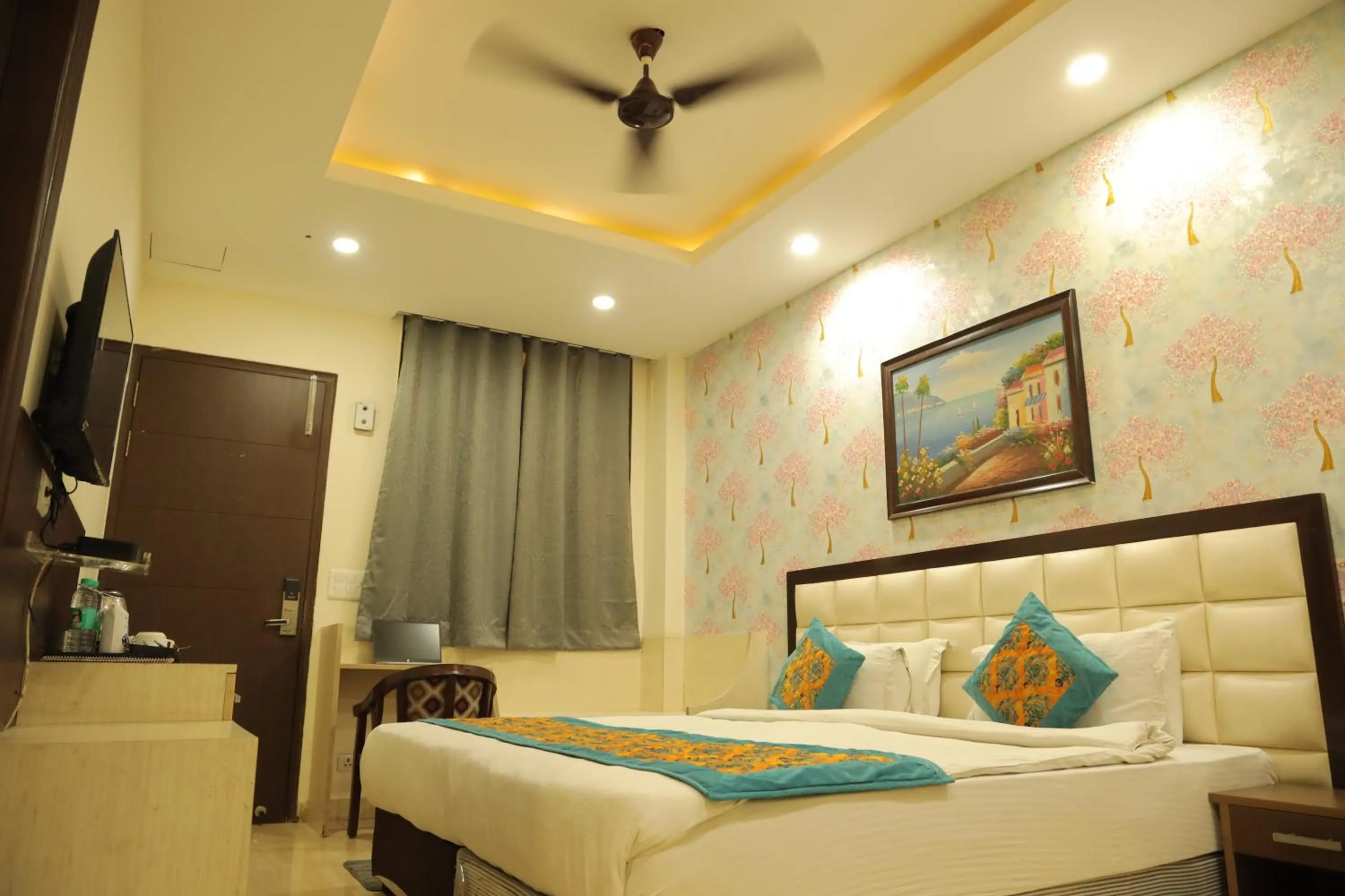 Bed in Hotel Nirvana Suites