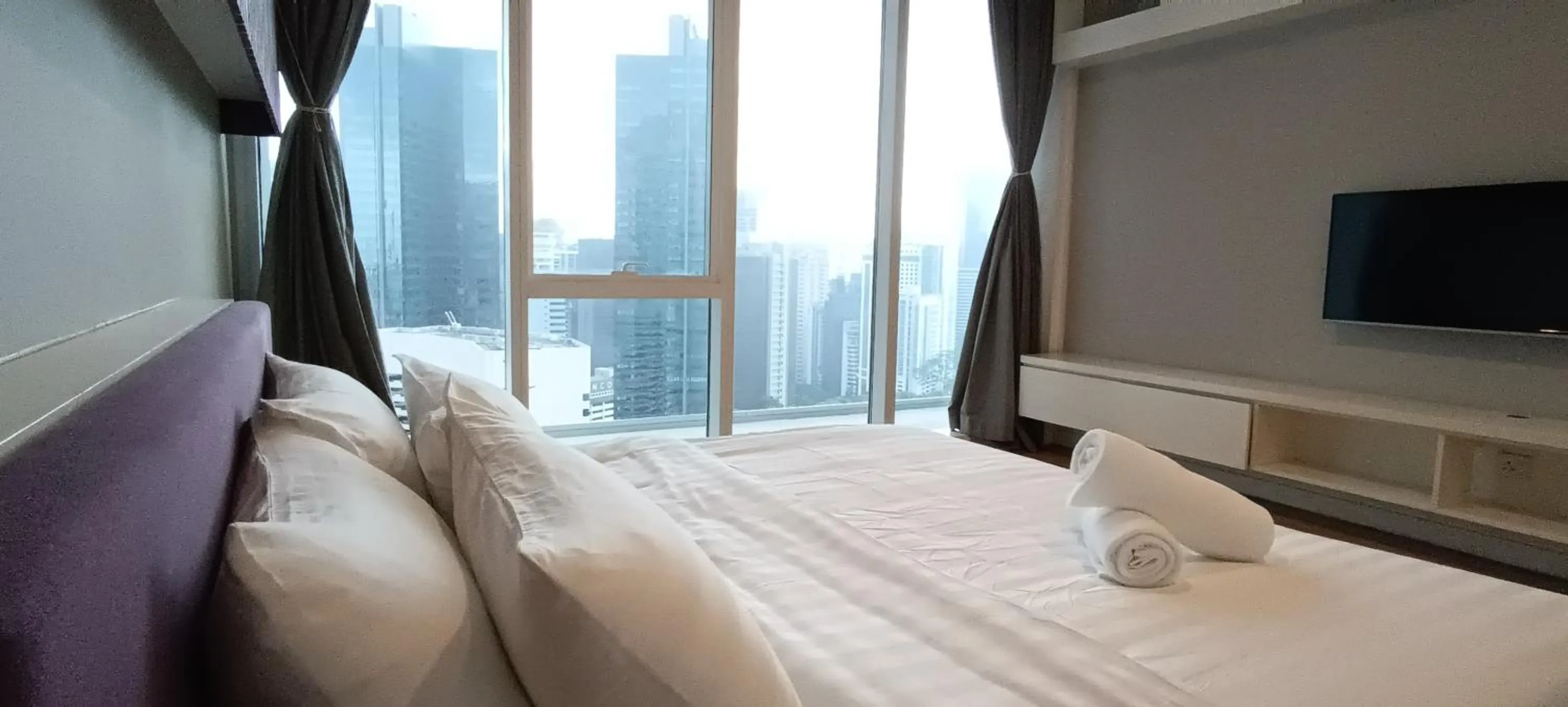 Bed in SKYWARD SUITES at Platinum KLCC