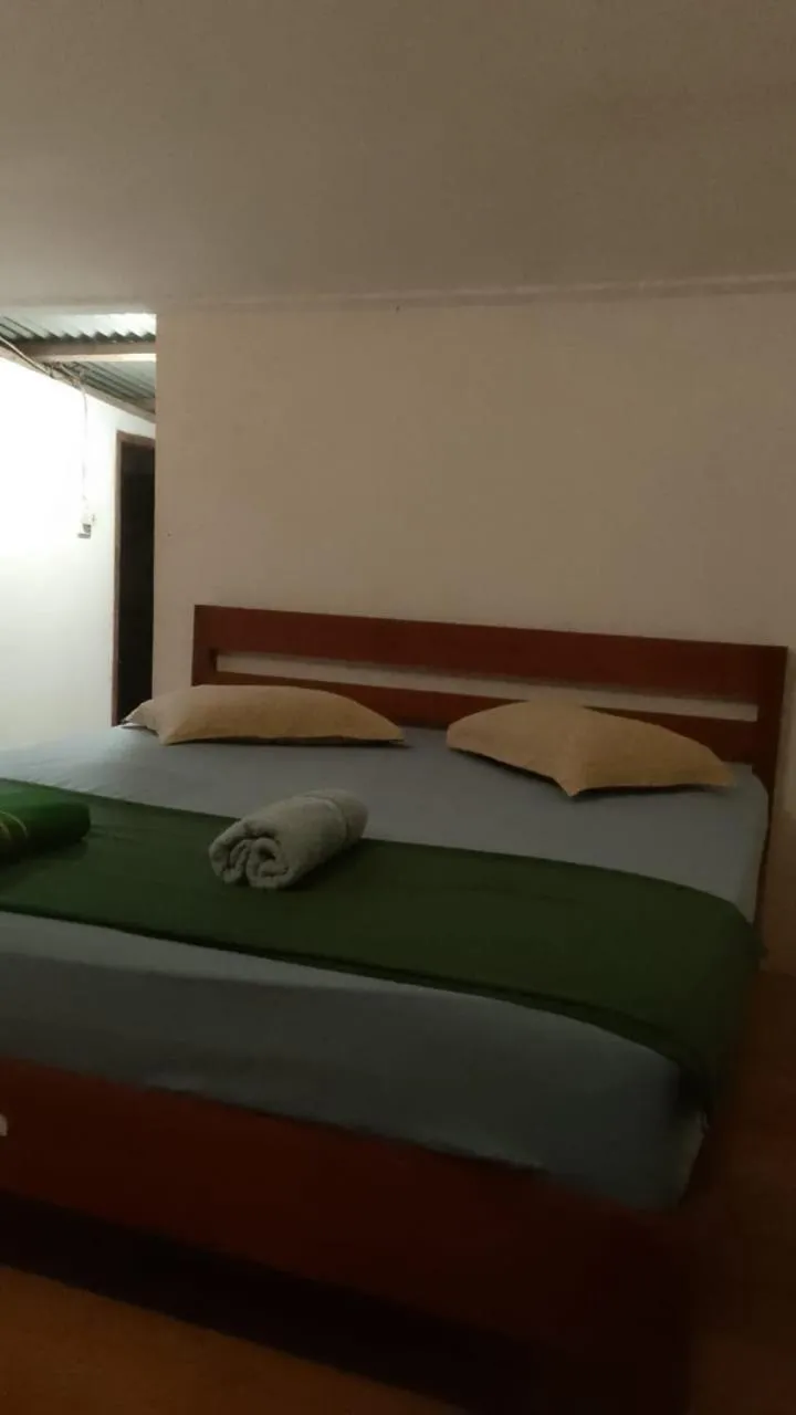 Bed in Olala Bungalows and Restaurant