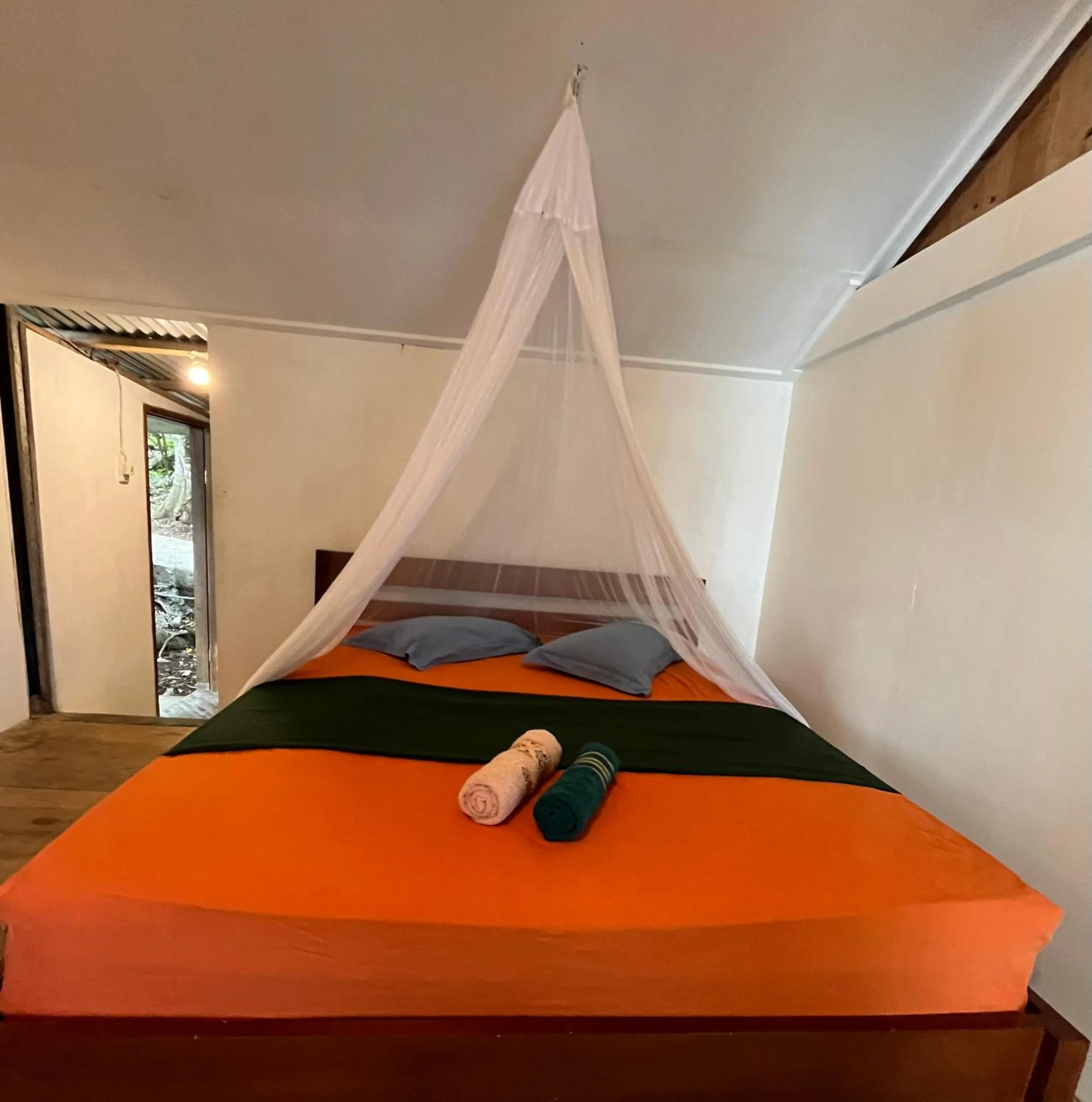 Bed in Olala Bungalows and Restaurant