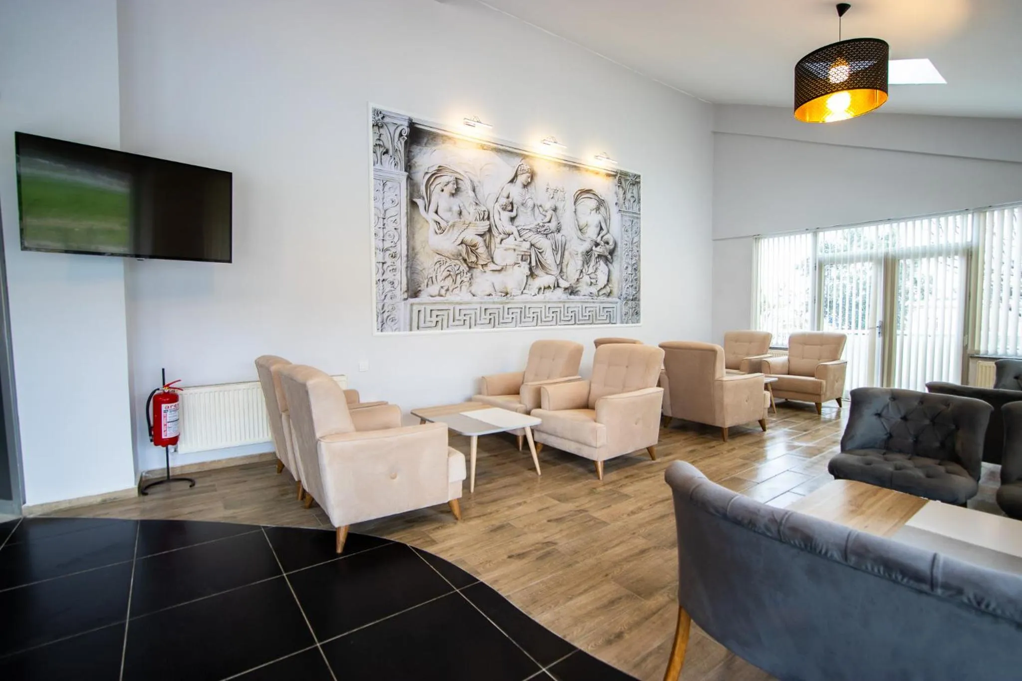 Communal lounge/ TV room in Hotel Le Marin