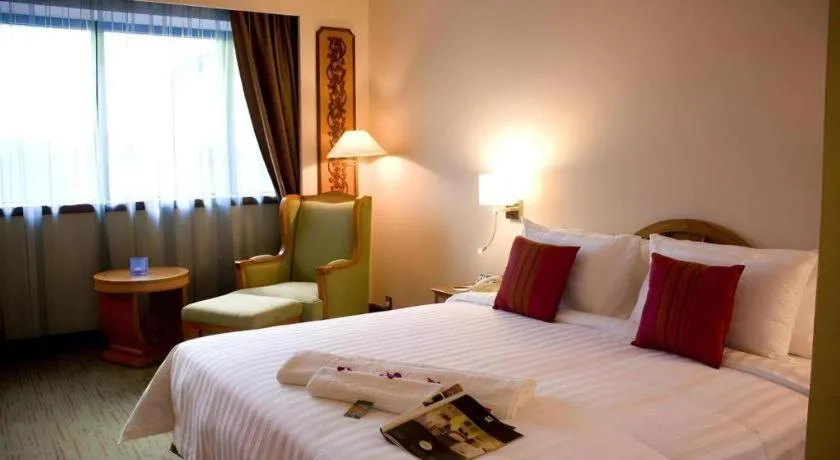 Bed in The CentrePoint Hotel