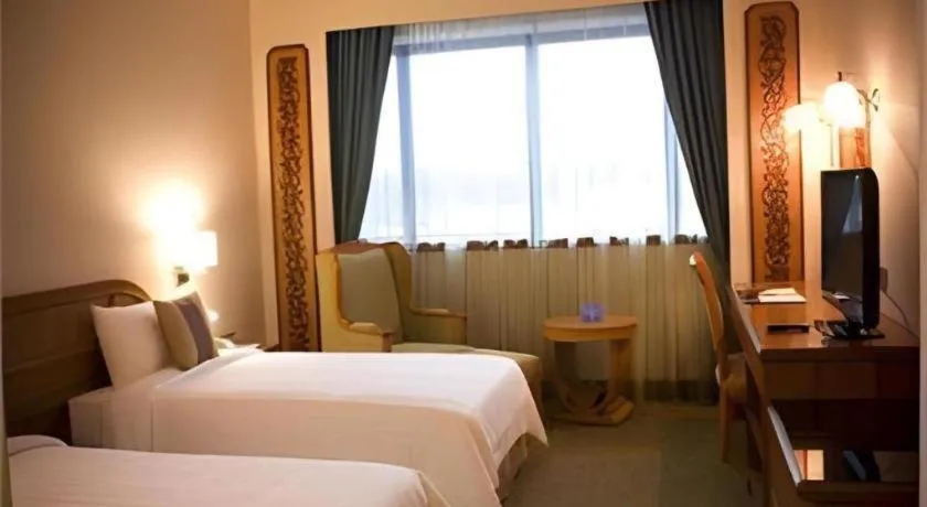 Bed in The CentrePoint Hotel