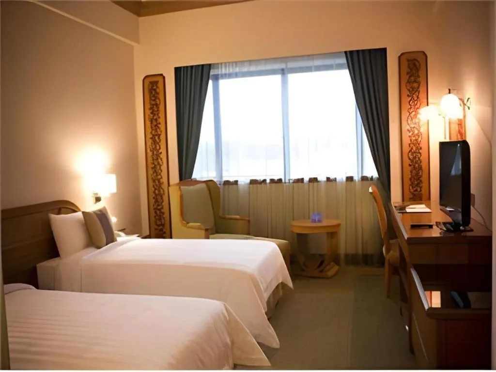 Bed in The CentrePoint Hotel