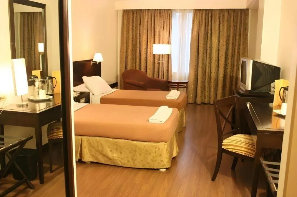 Bed in Hotel Supreme Convention Plaza